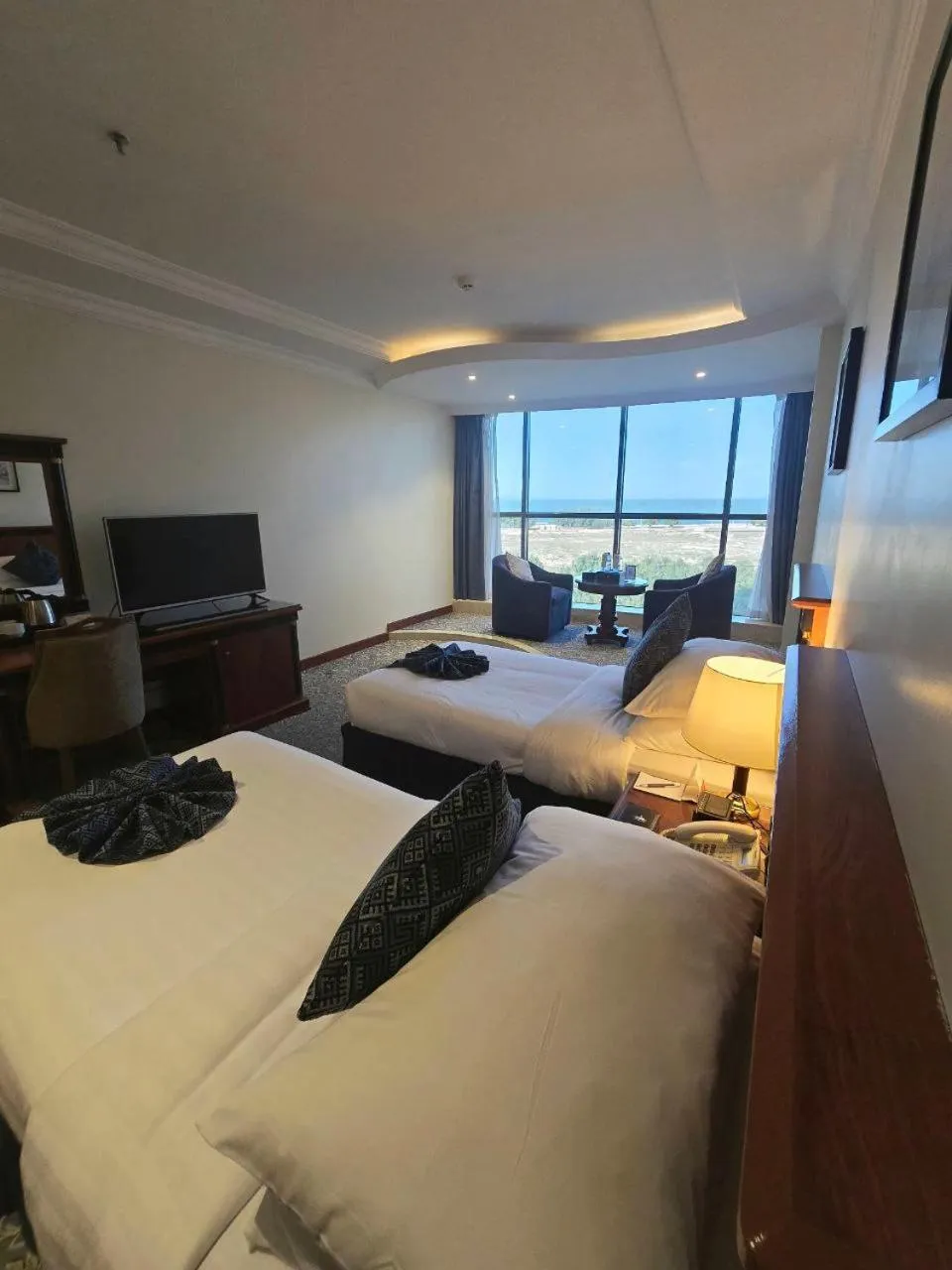 Bed in Crown Tower Hotel