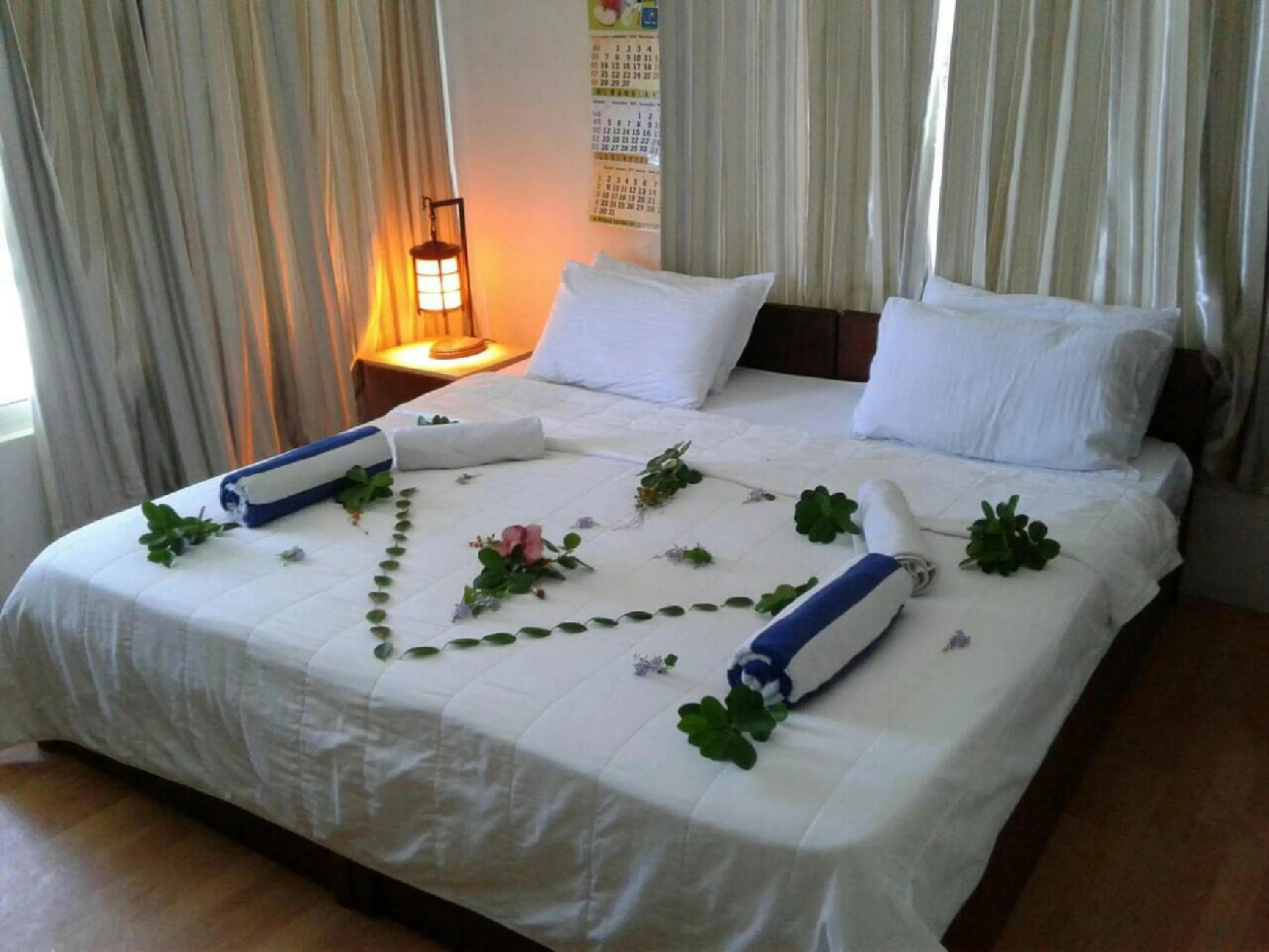 Property building, Bed in Batuta Maldives Surf View