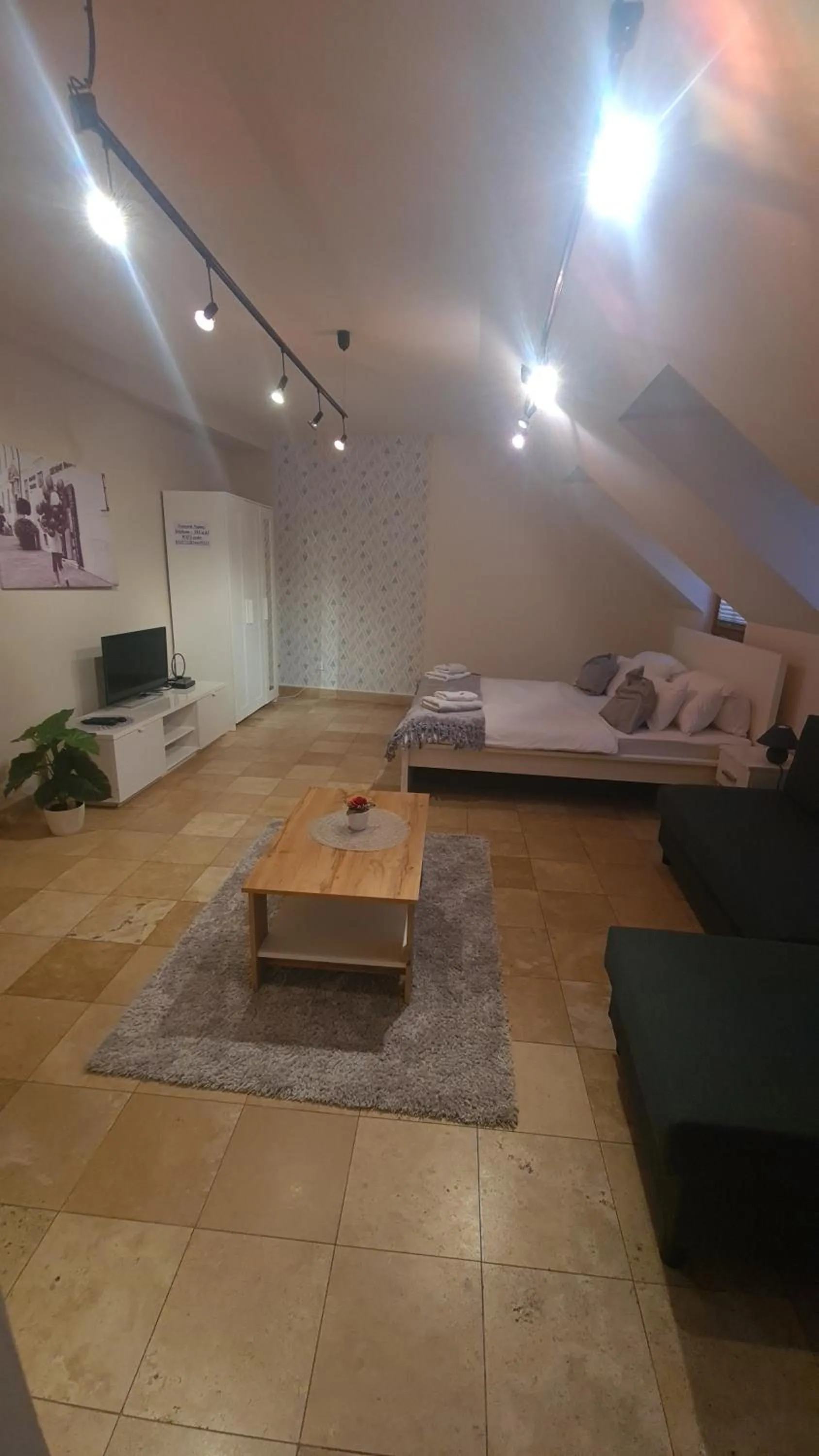 Bed in Downtown Apartments DeLuxe