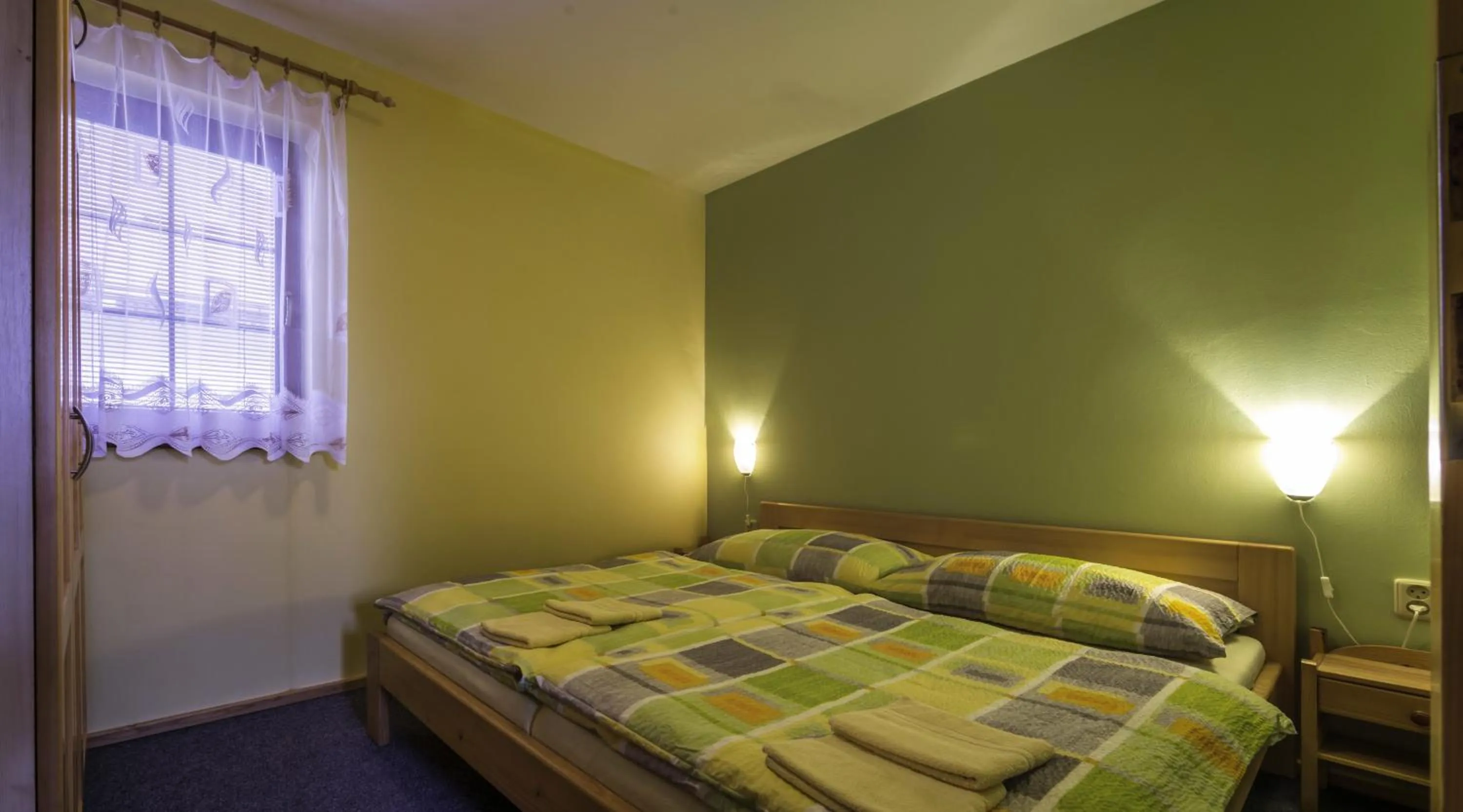 Bed in Ada Apartments