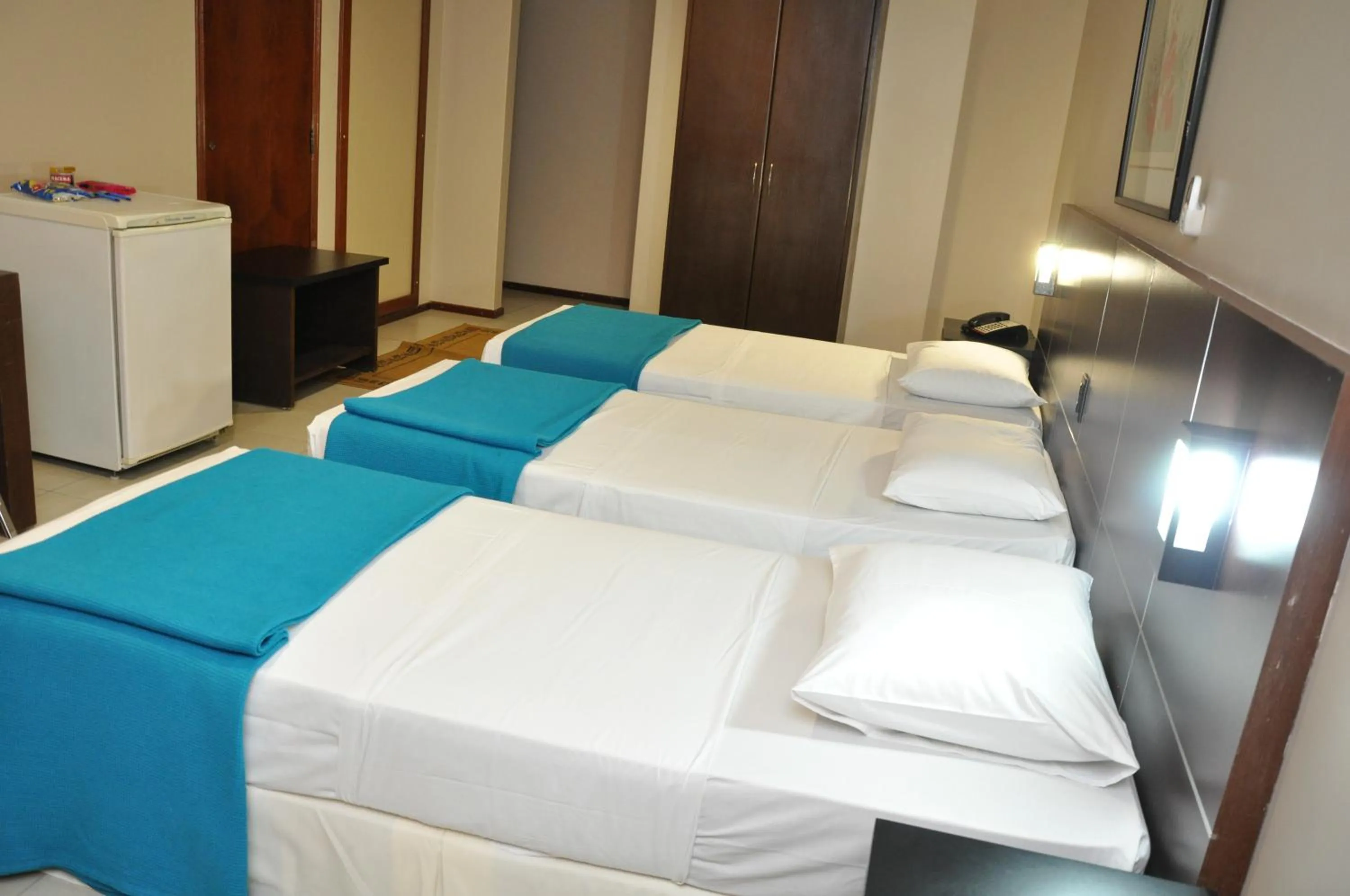 Bed in Crystal Plaza Hotel