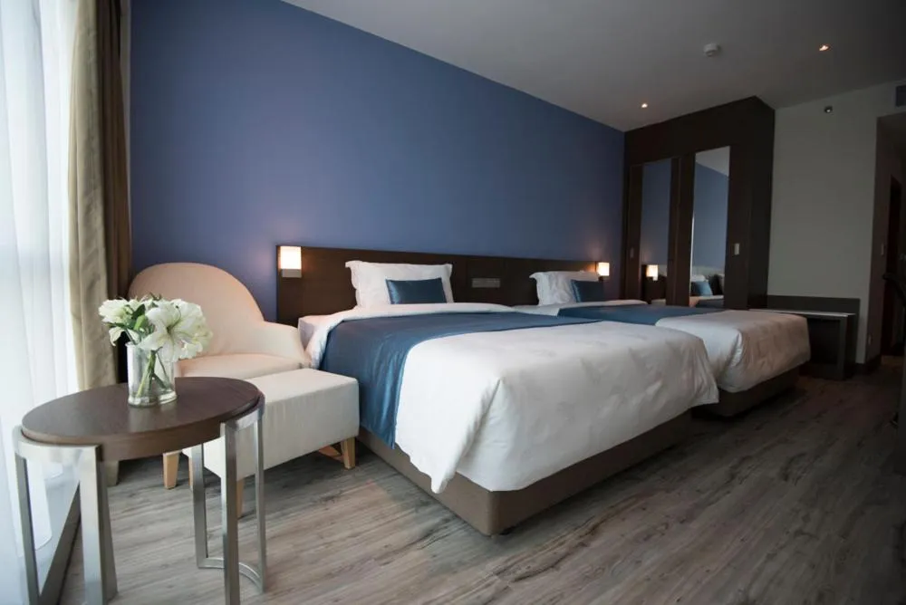 Bed in Astana Wing - Riverside Majestic Hotel