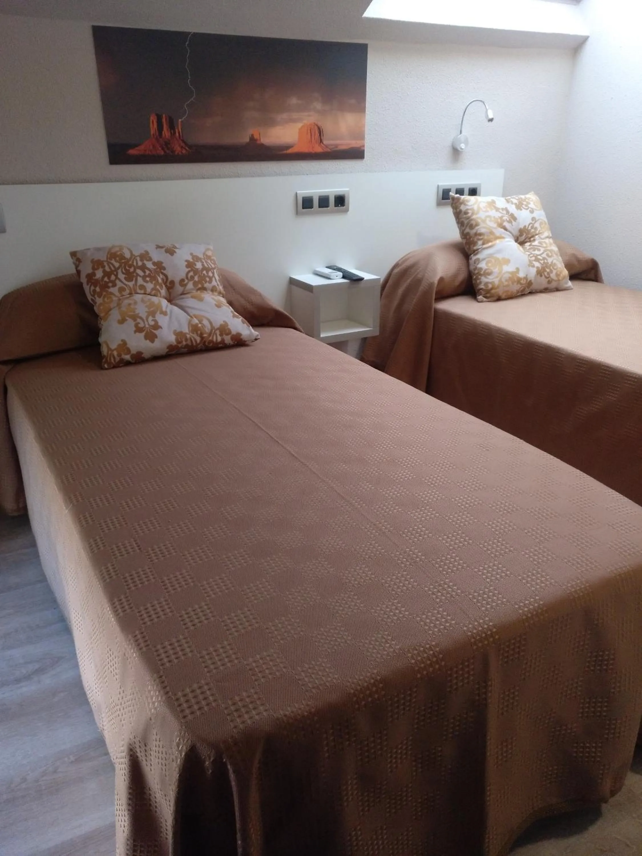Bed in Travesia Rooms