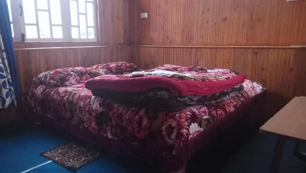 Bed in Sinkawli Homestay