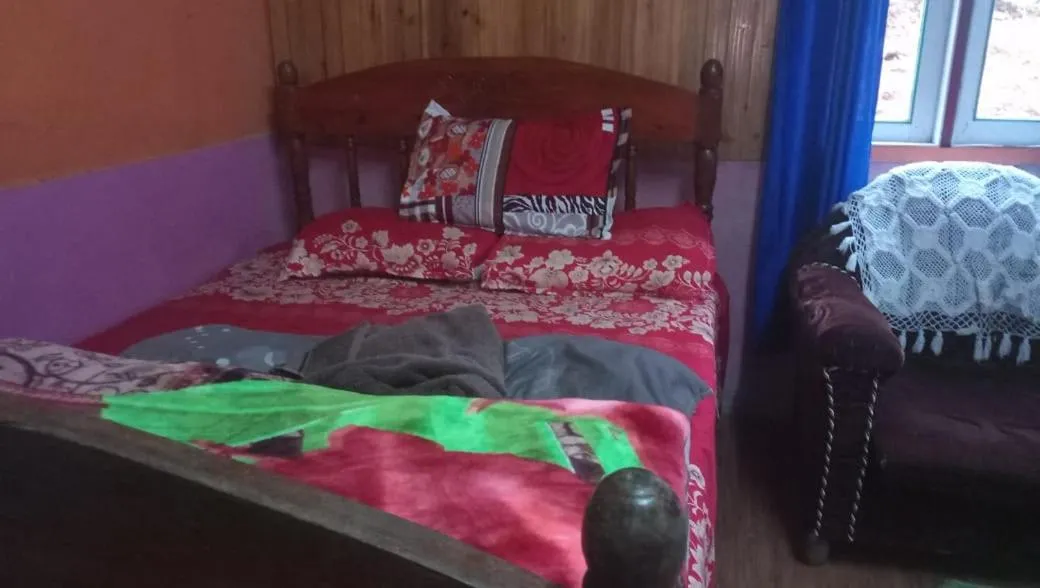 Bed in Sinkawli Homestay