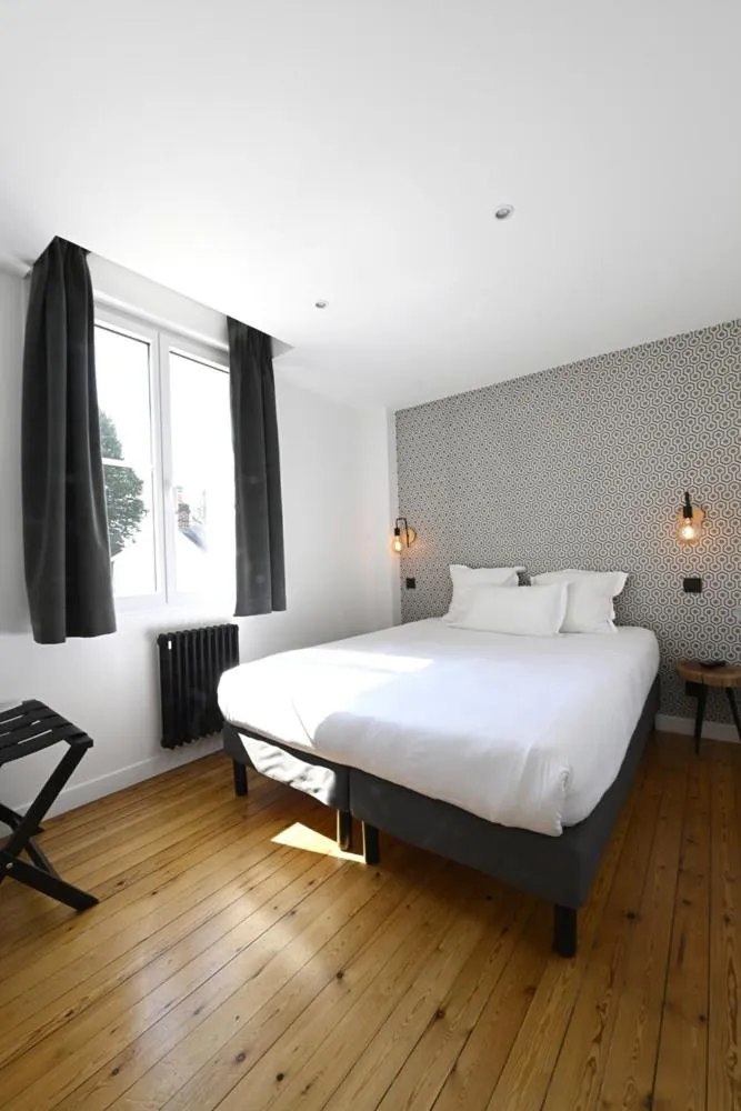 Bed in Manoir de l'évêché et Spa