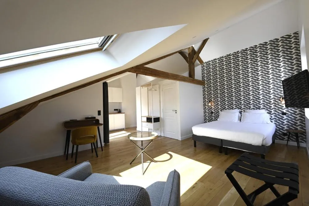 Bed in Manoir de l'évêché et Spa