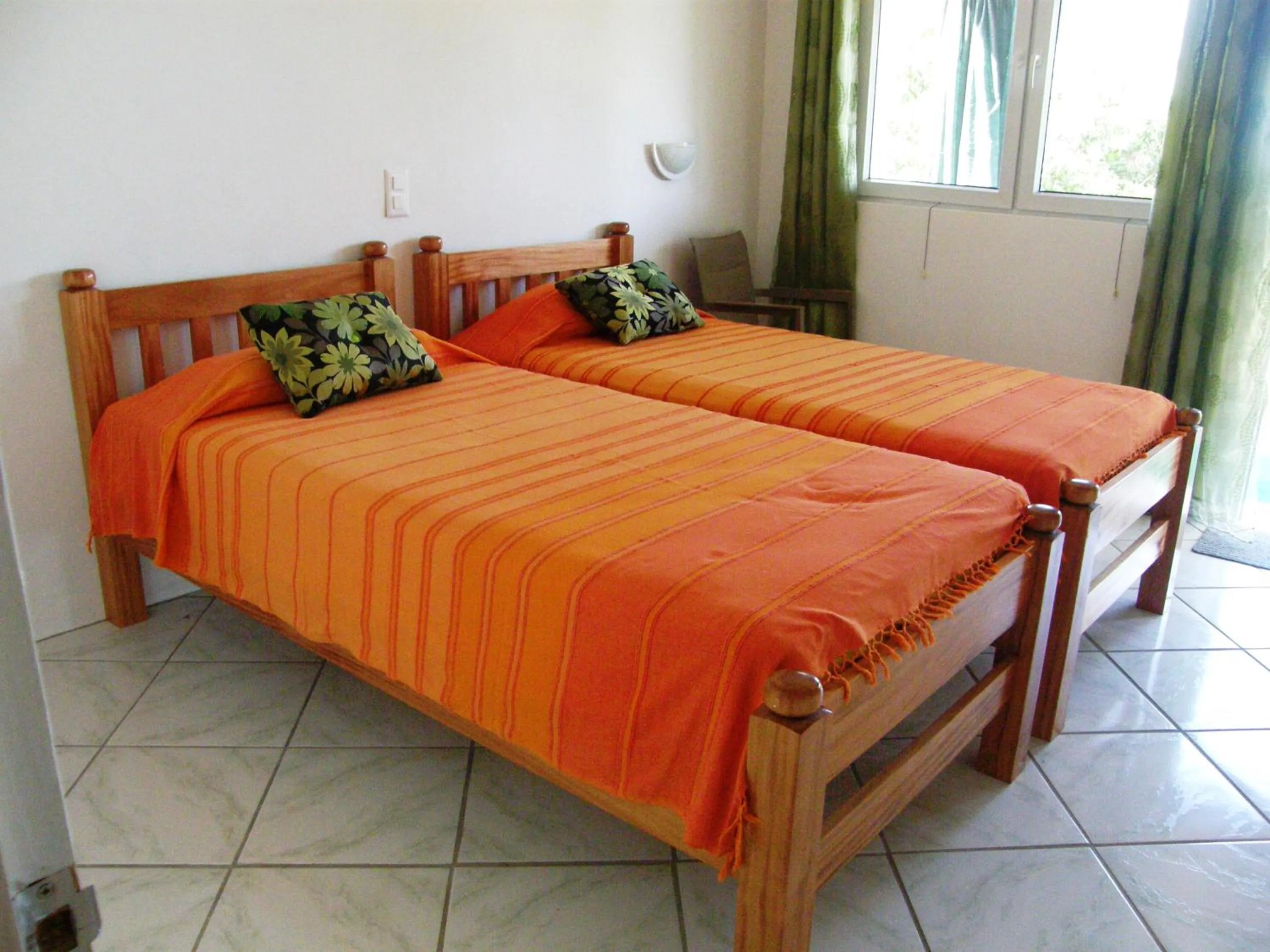 Bed in Tamarind Tree Hotel