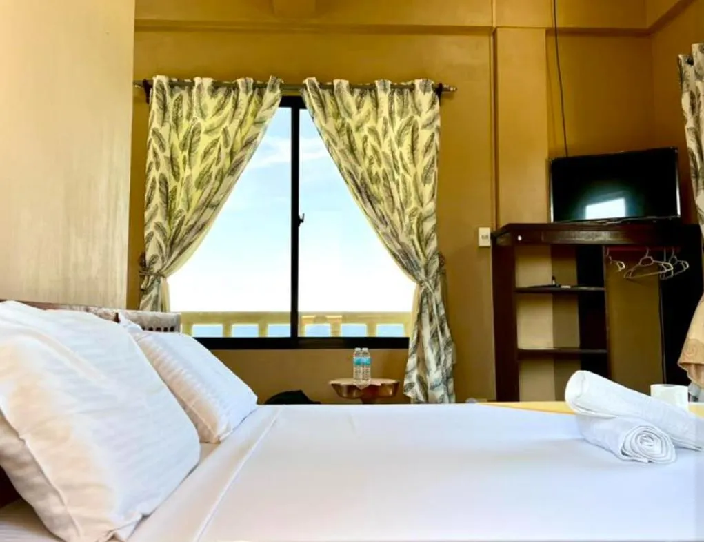 Bed in Oceanfront Beach Resort