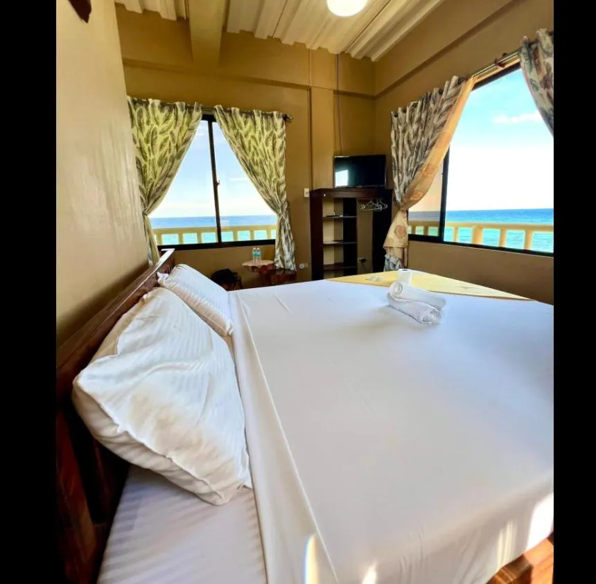 Bed in Oceanfront Beach Resort