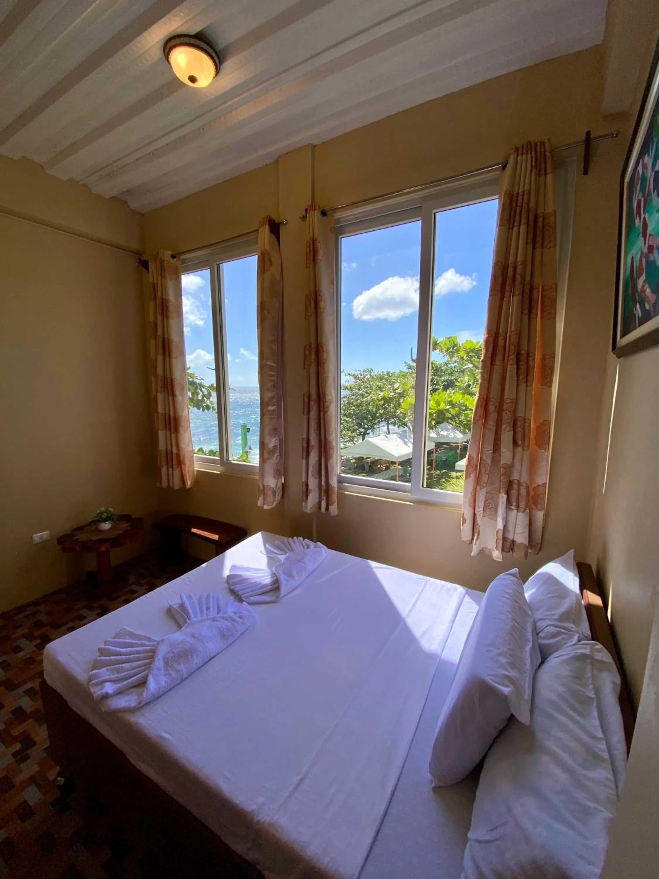 Bed in Oceanfront Beach Resort