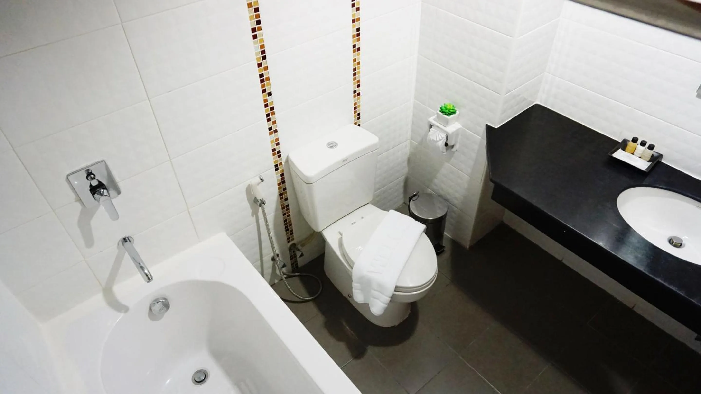 Toilet in The Greenery central suite & hotel