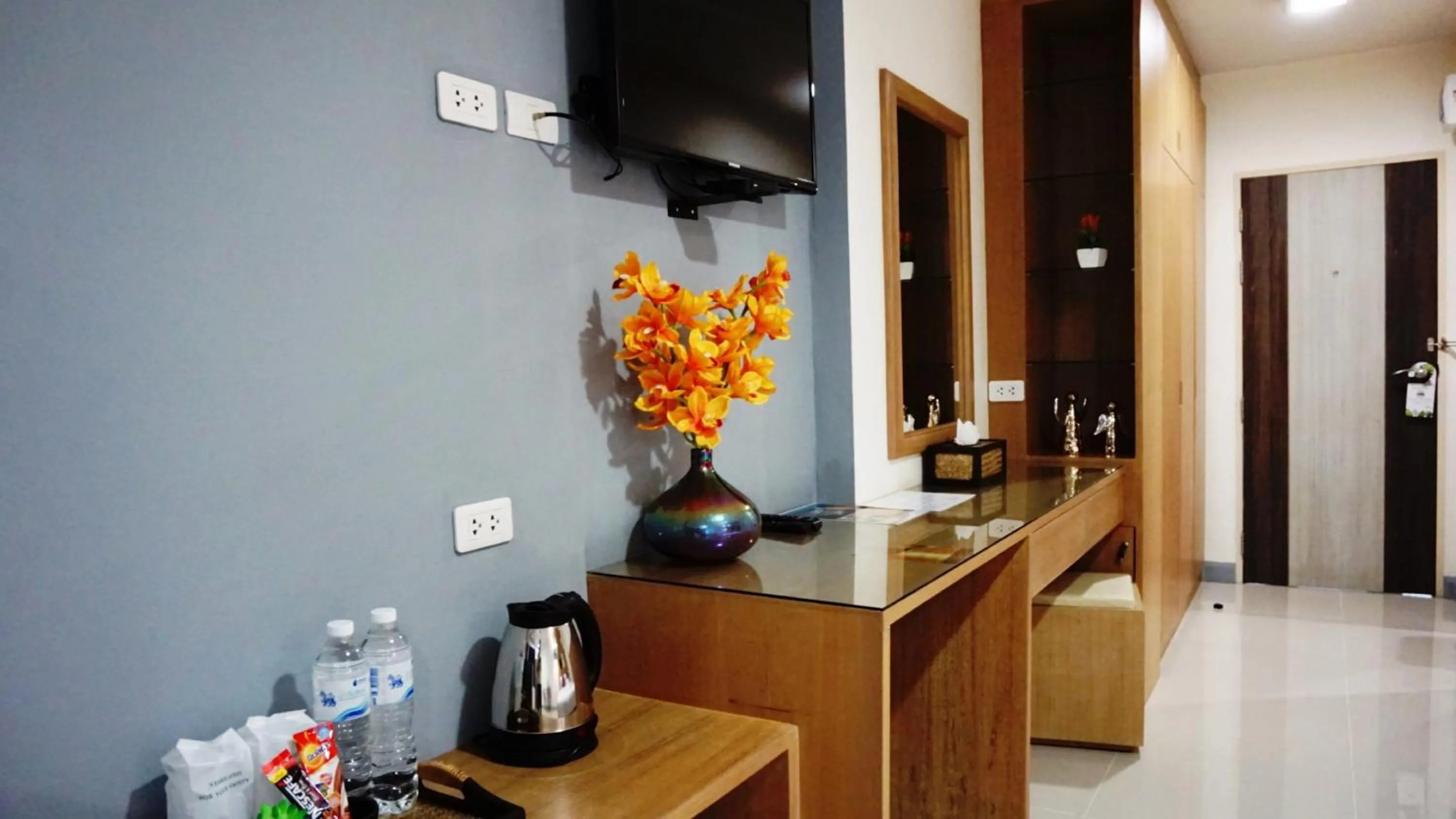 TV and multimedia in The Greenery central suite & hotel