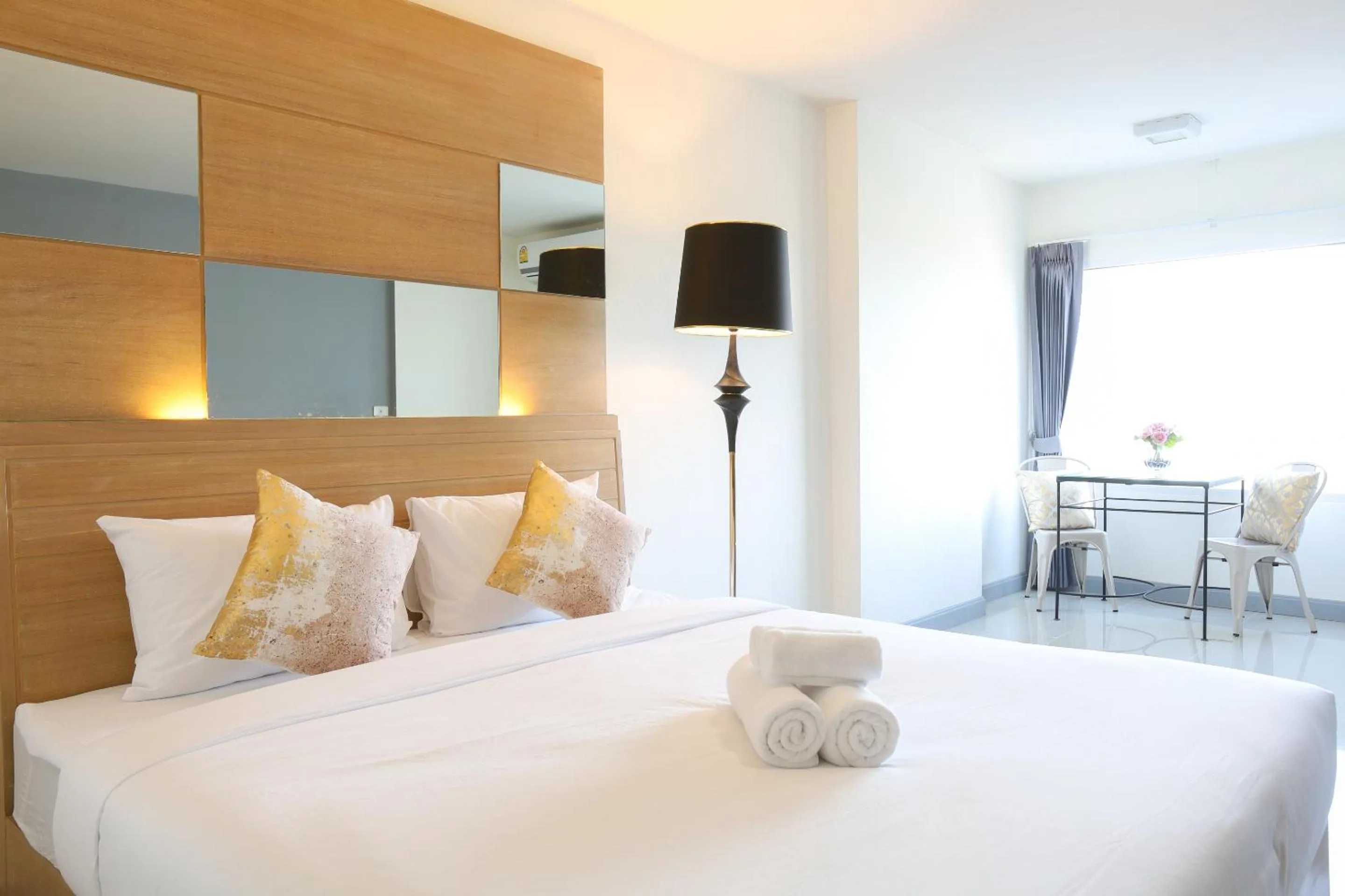 Bed in The Greenery central suite & hotel