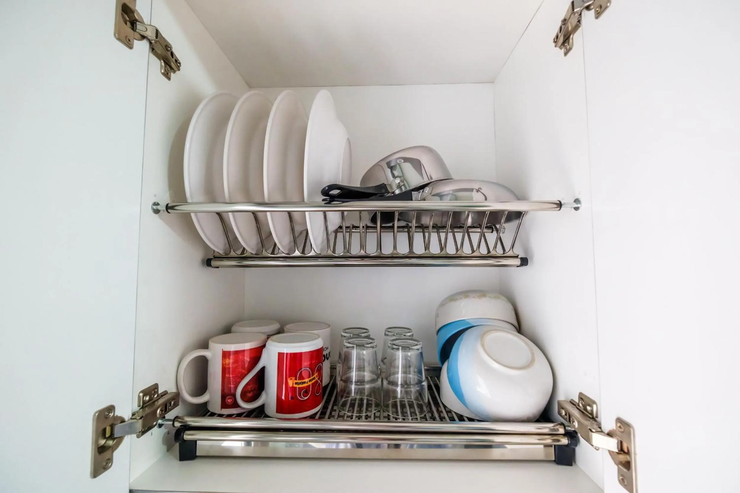 Kitchen or kitchenette in Modern and Comfort 2BR Bassura City Apartment By Travelio