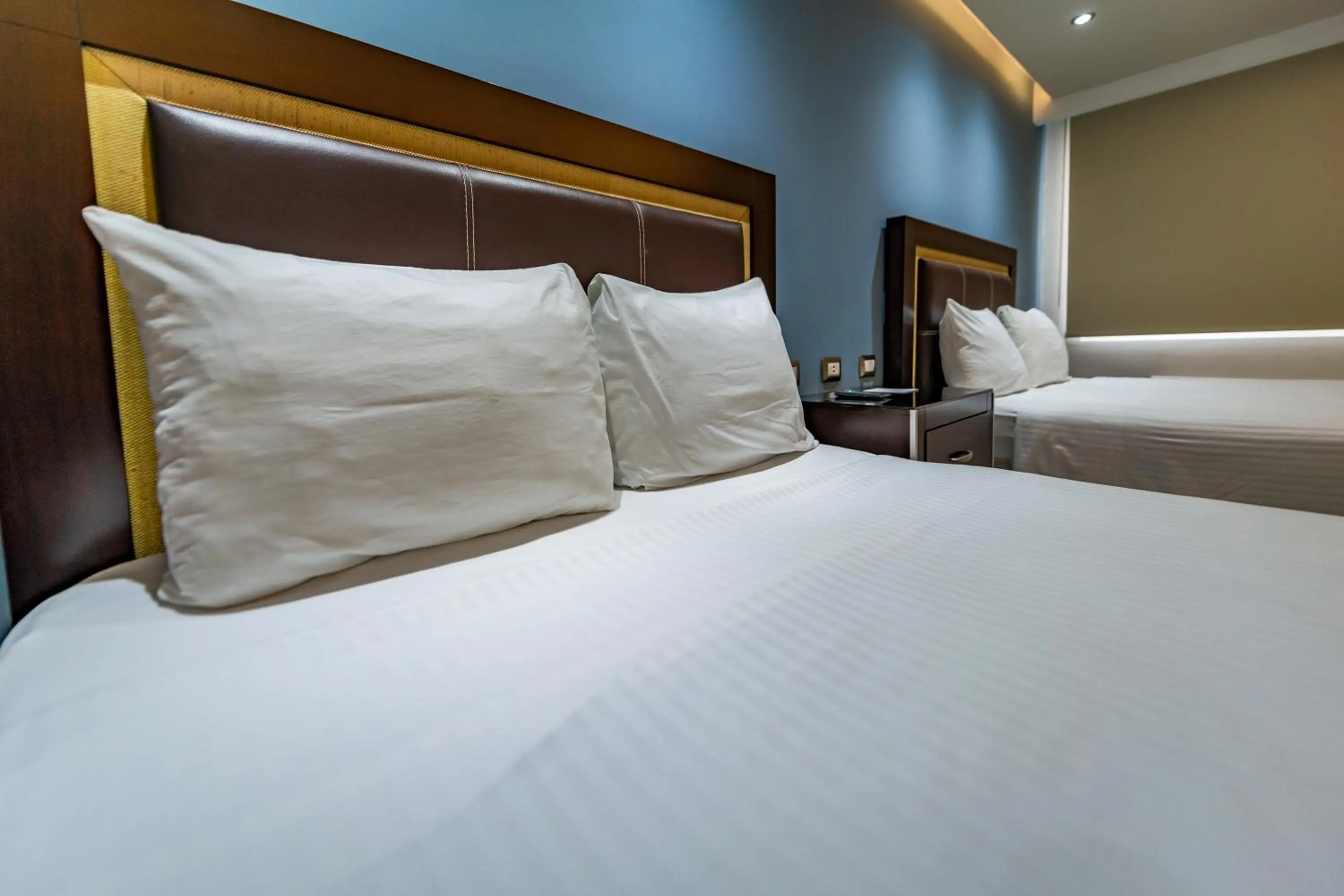 Bed in Quinta Dorada Hotel & Suites