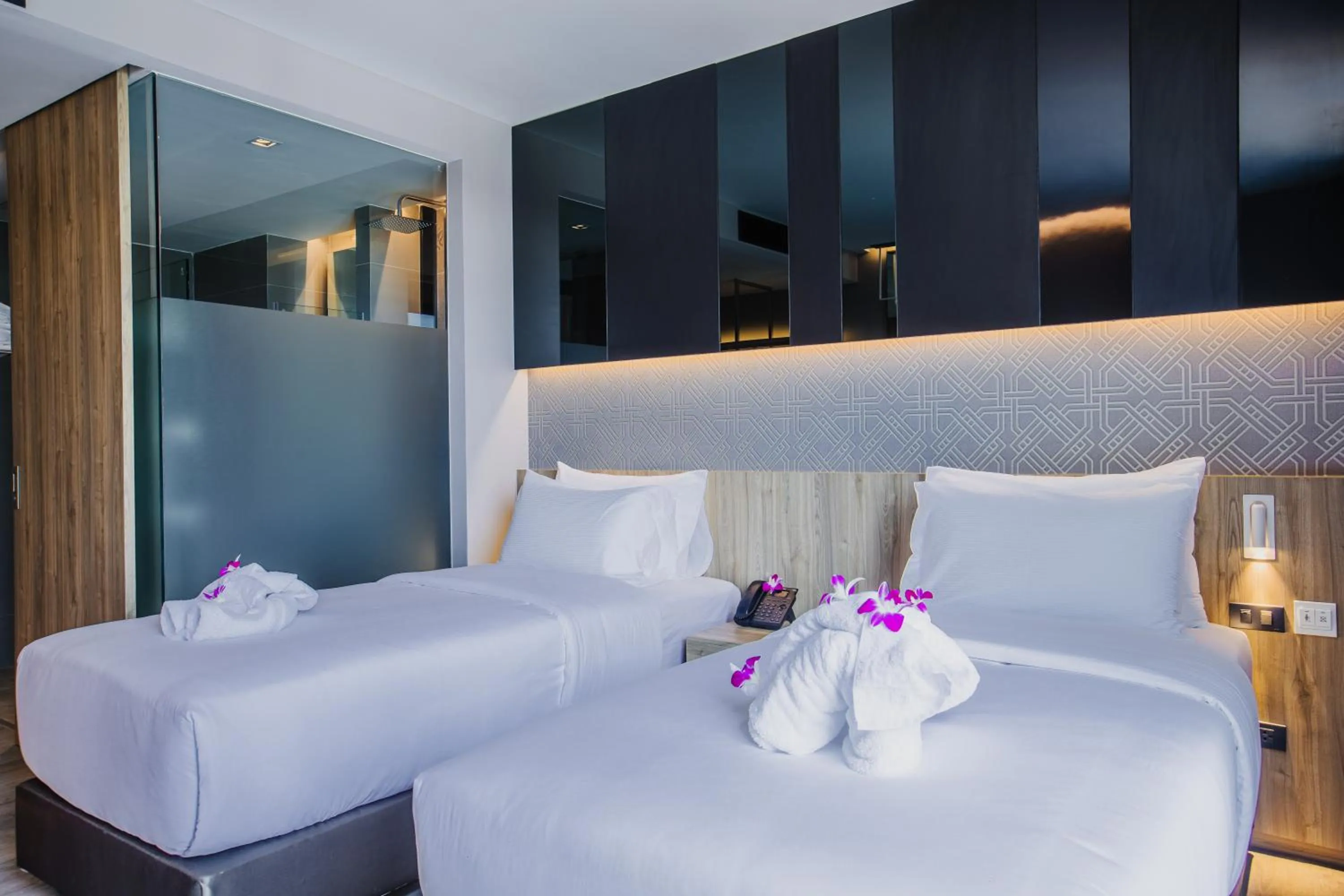 Bed in Rak Elegant Hotel Patong