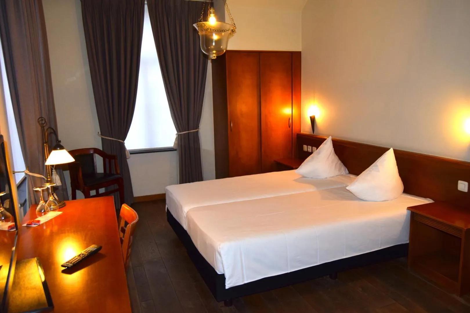 Bed in Oranje City Hotel