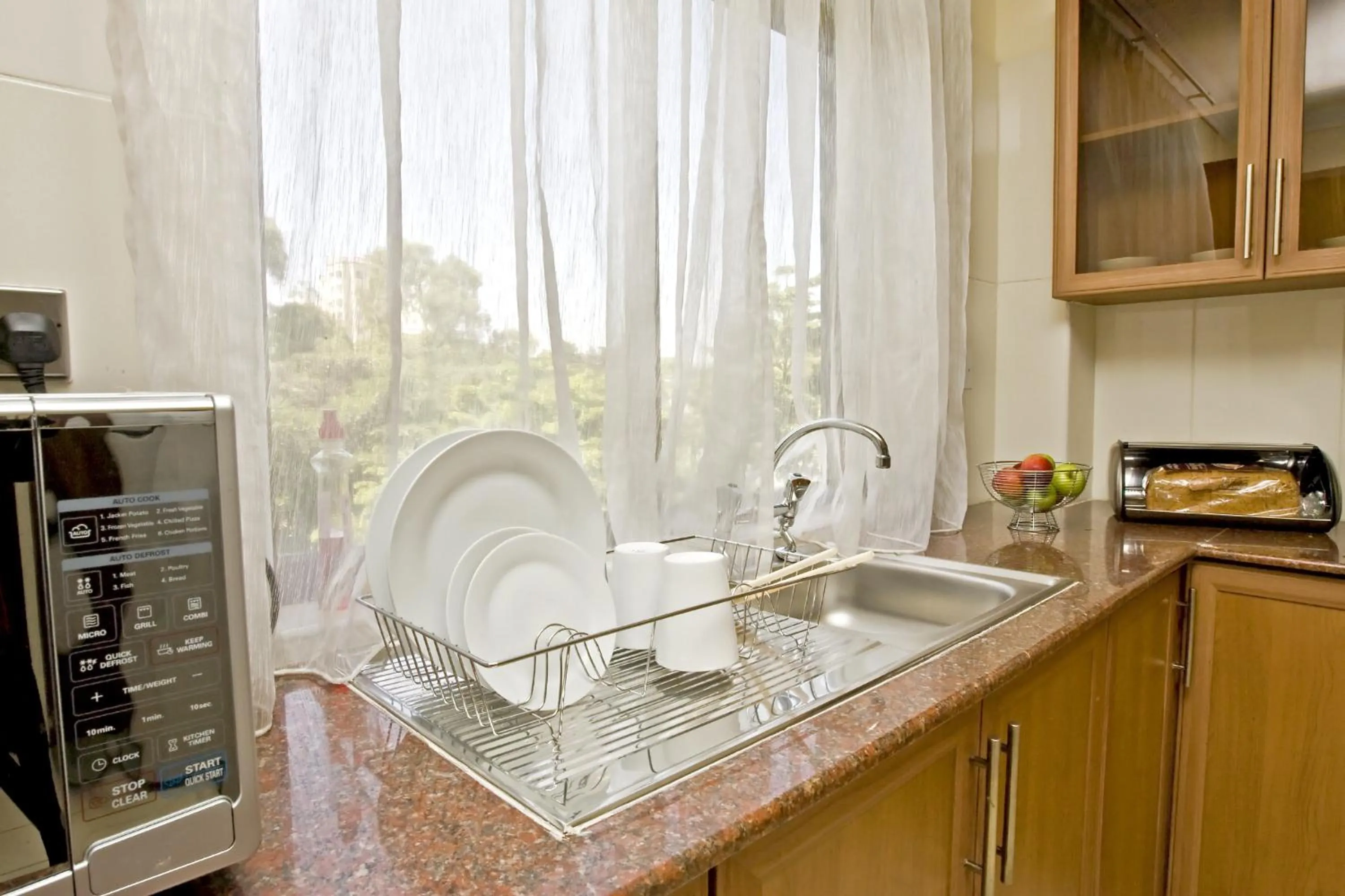 Kitchen or kitchenette in GemSuites Serviced Apartments State House