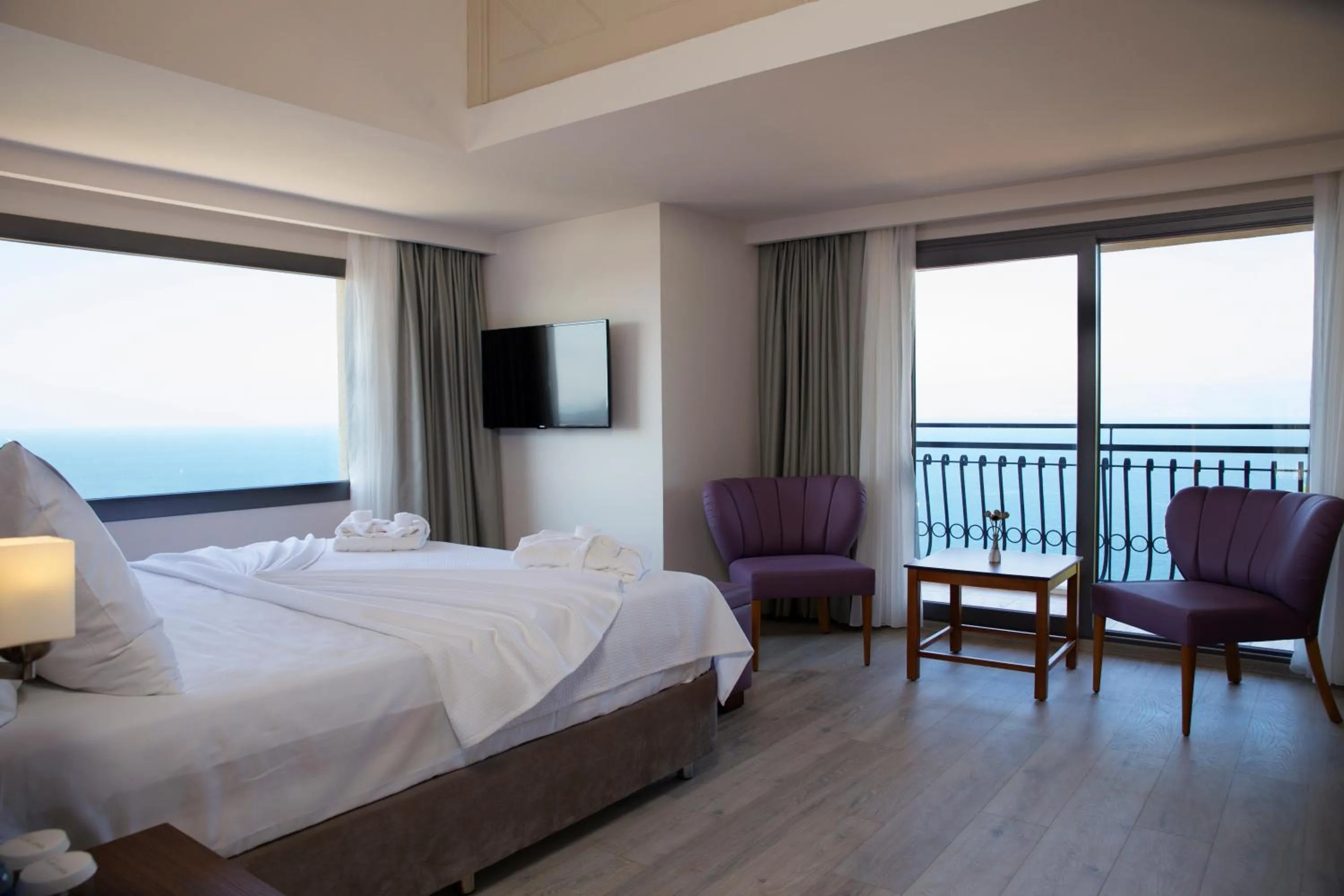 Seating area, Bed in Neopol Hotel