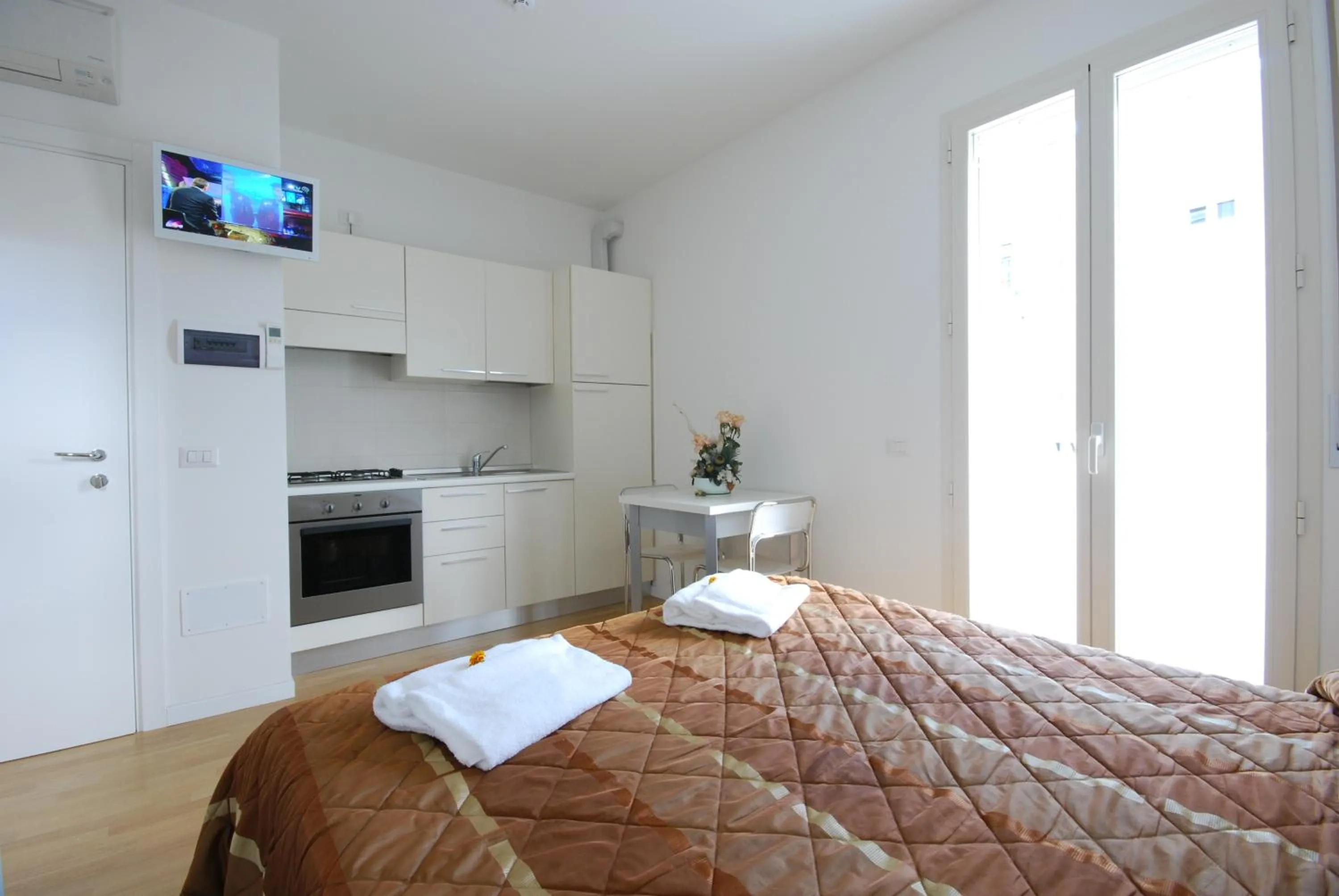 Bed in Amadei Hotel Figaro & Apartments