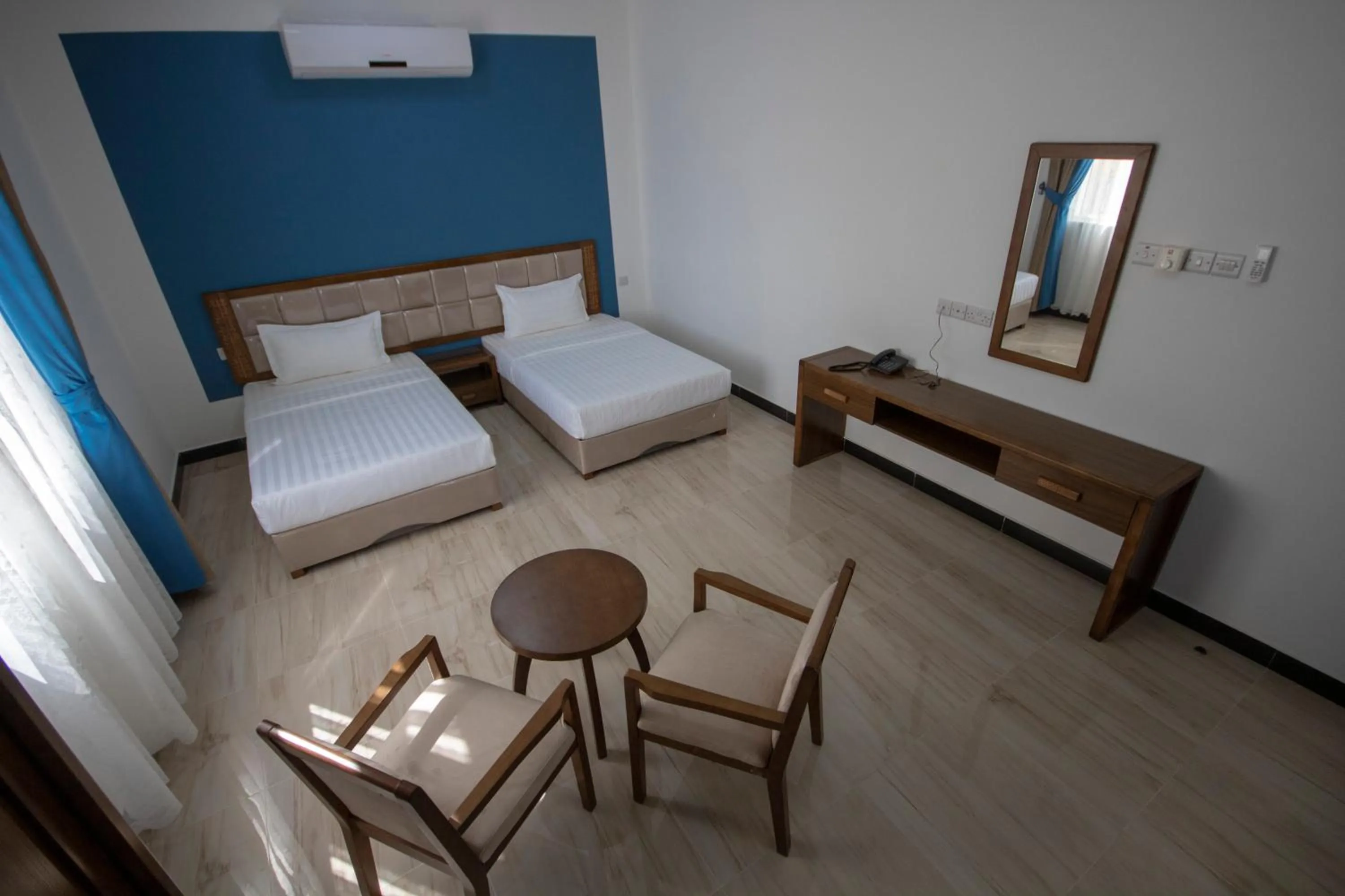 Bed in Home Station Hotel