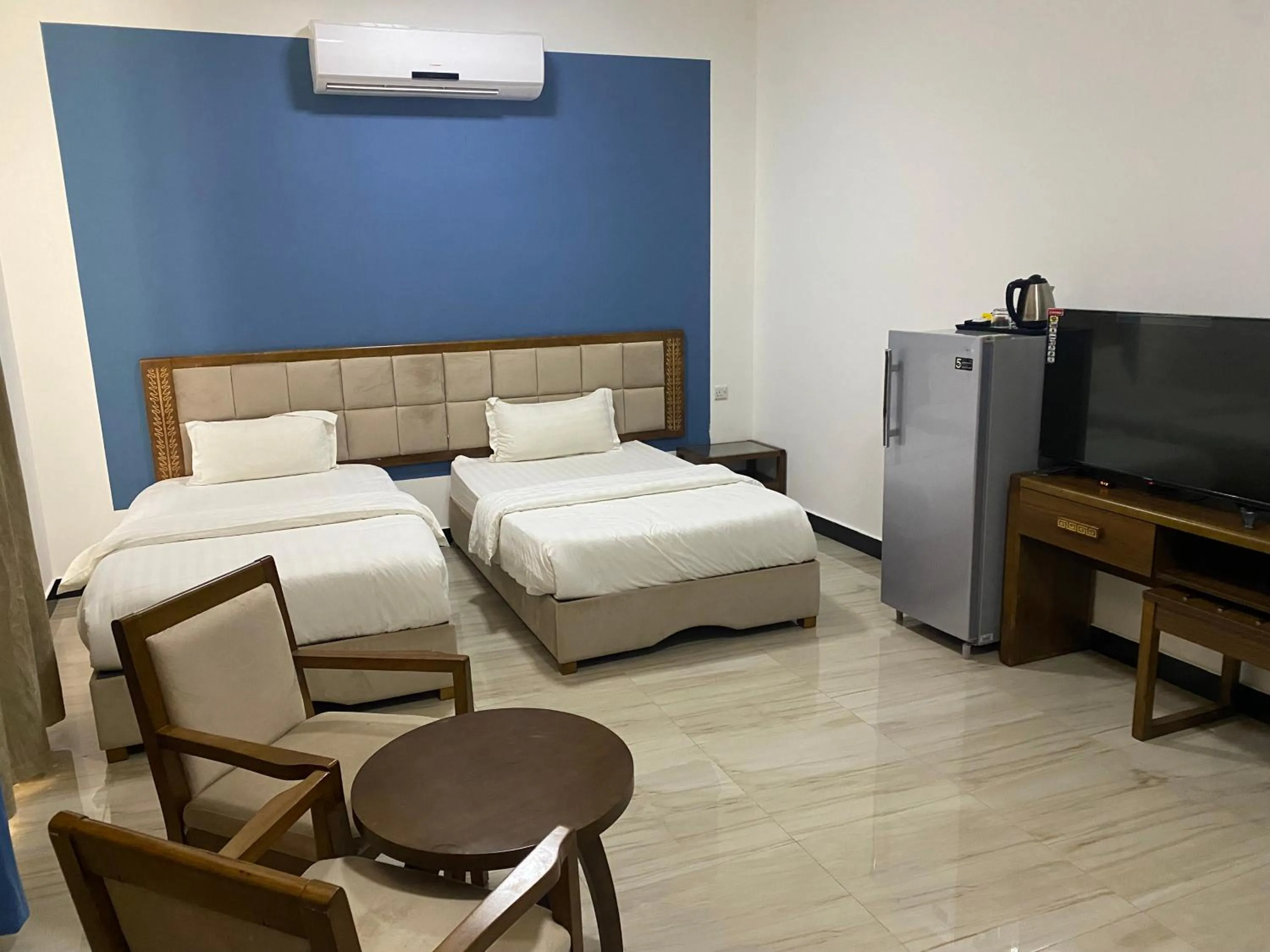 Bed in Home Station Hotel