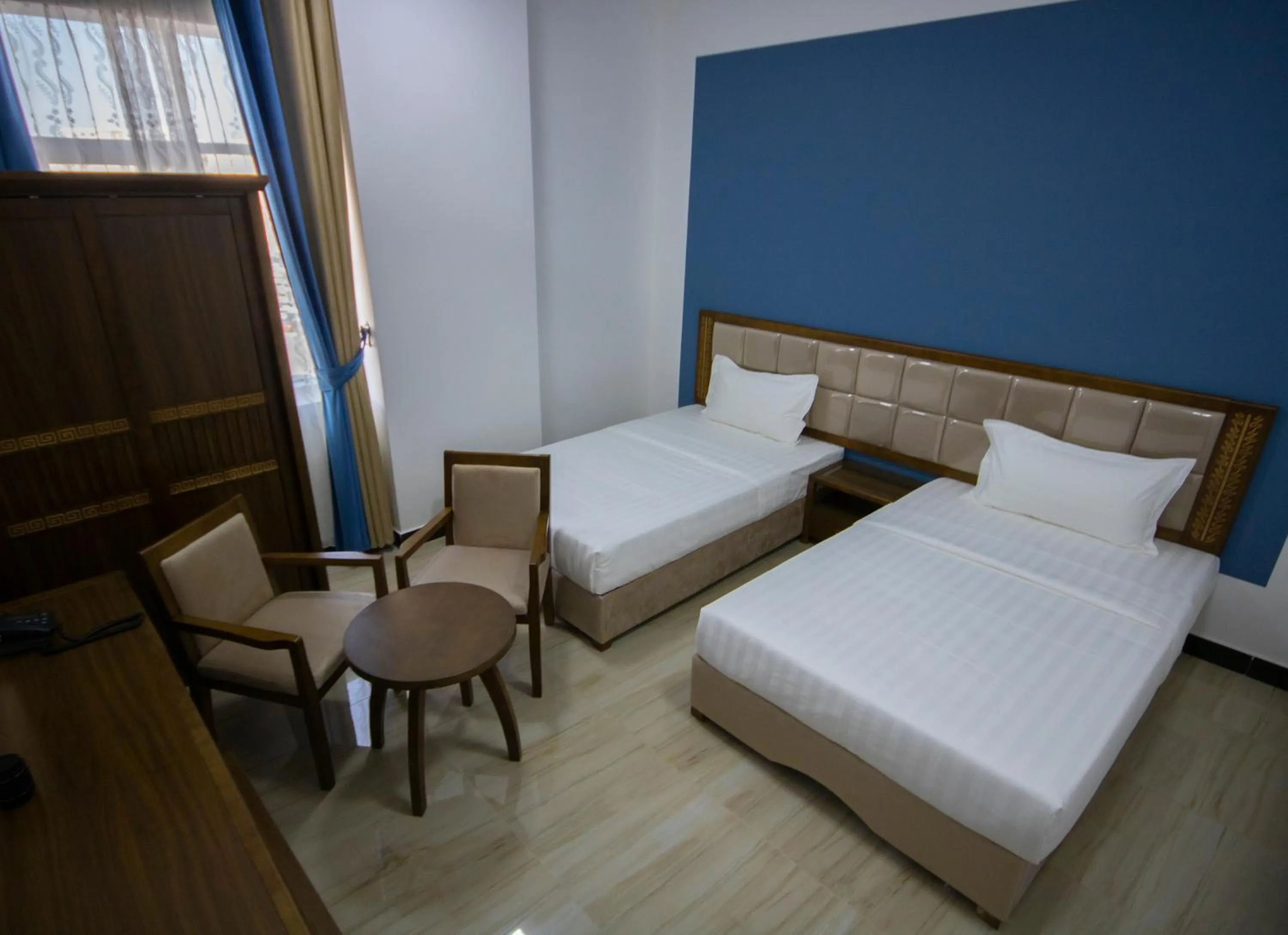 Bed in Home Station Hotel