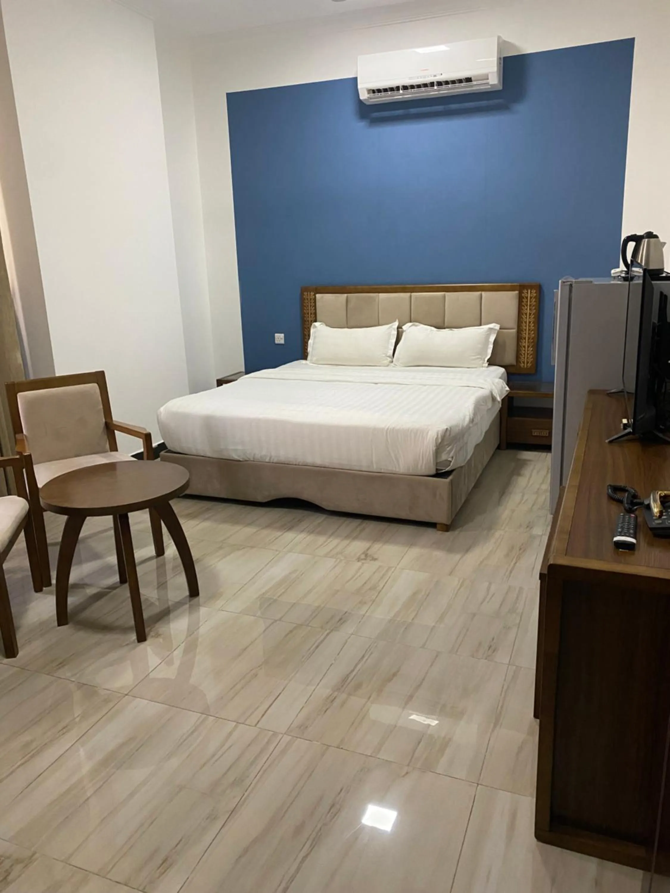 Bed in Home Station Hotel