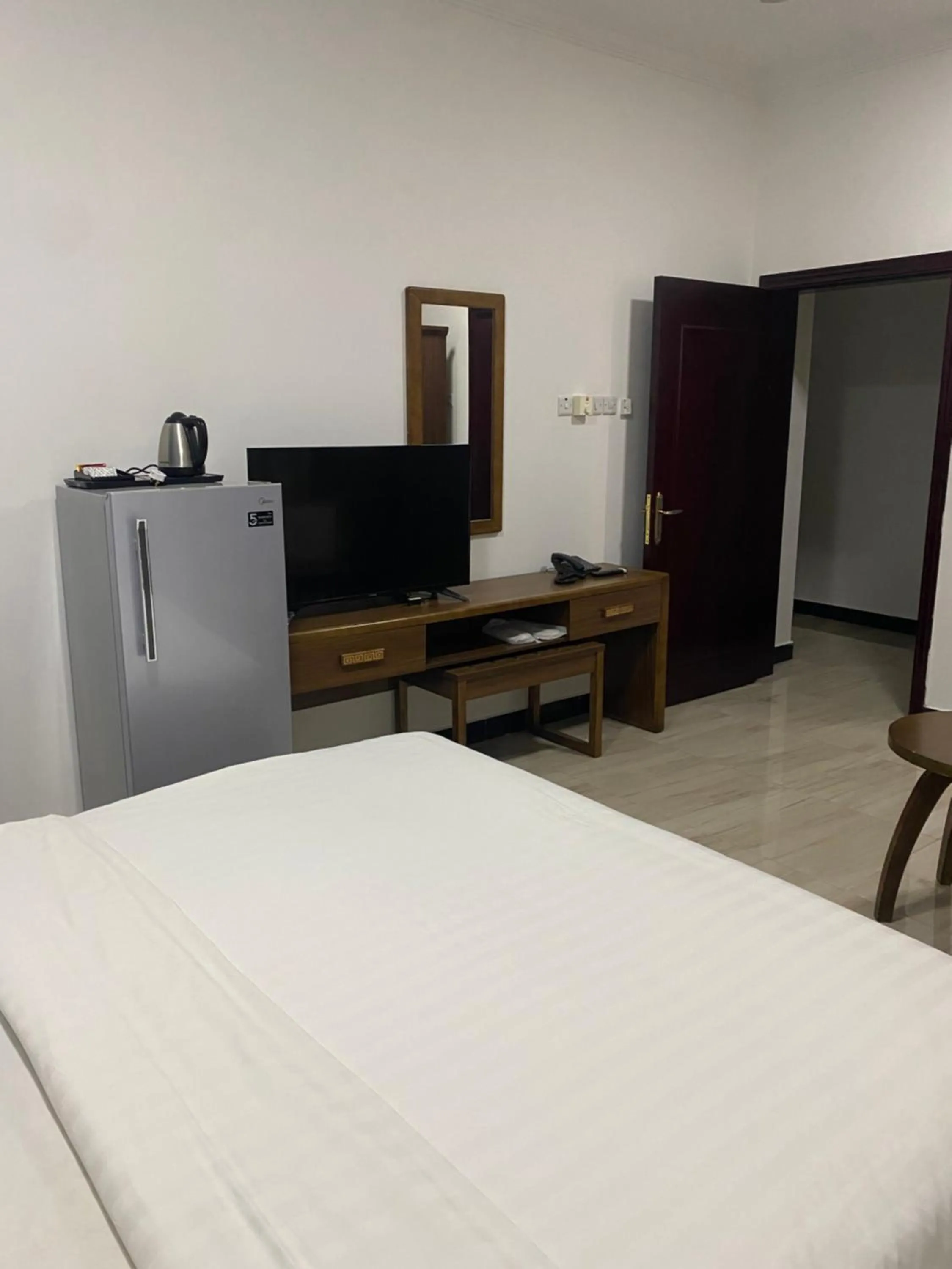 Bed in Home Station Hotel