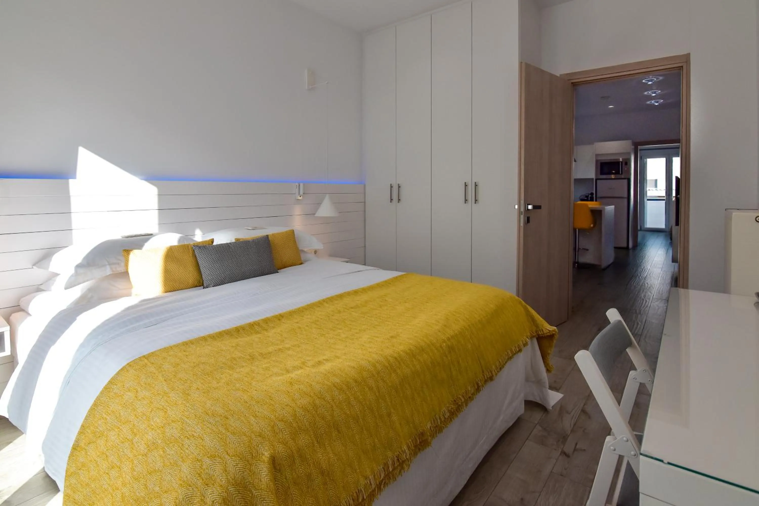 Bed in White Rock Milos Suites