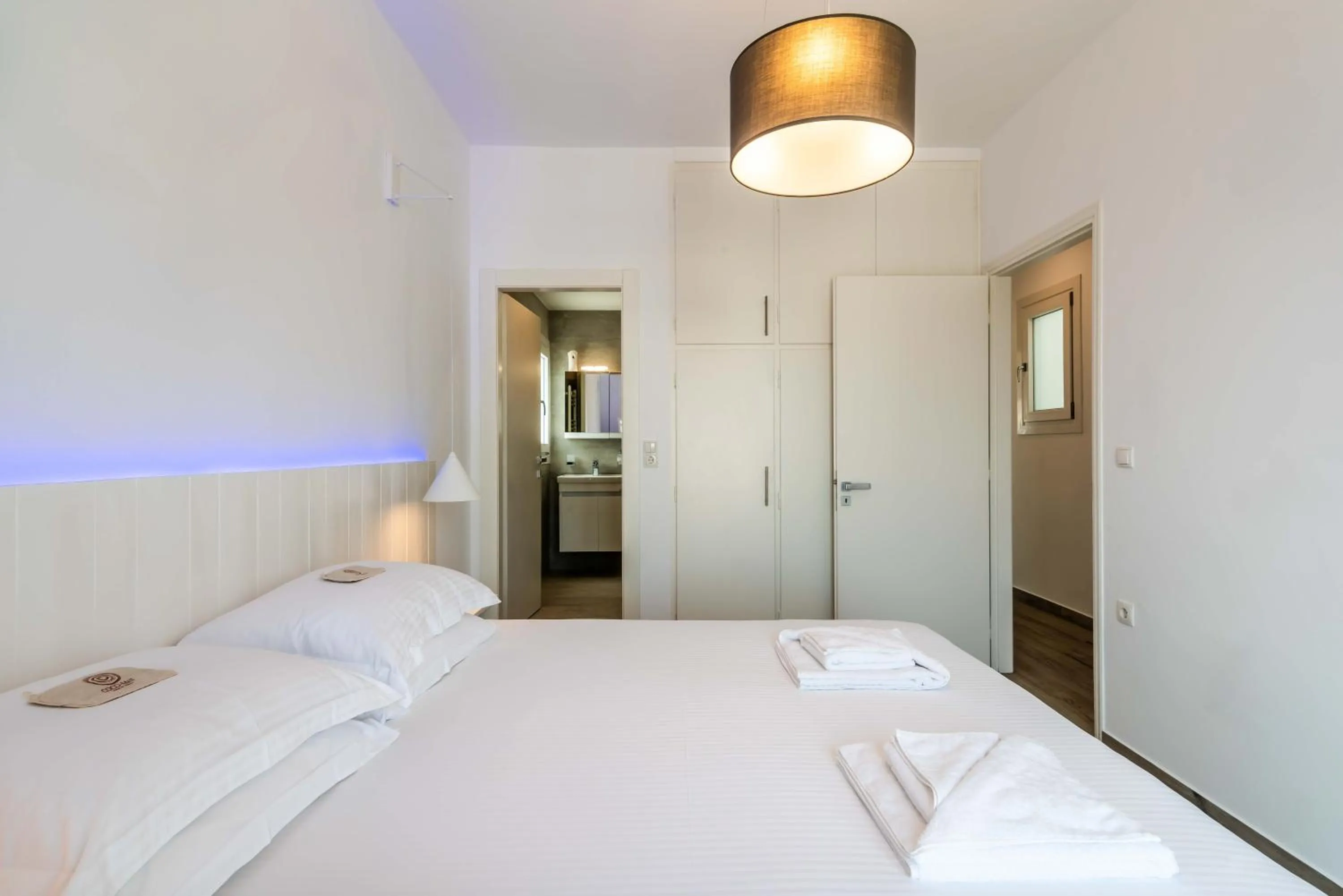 Bed in White Rock Milos Suites