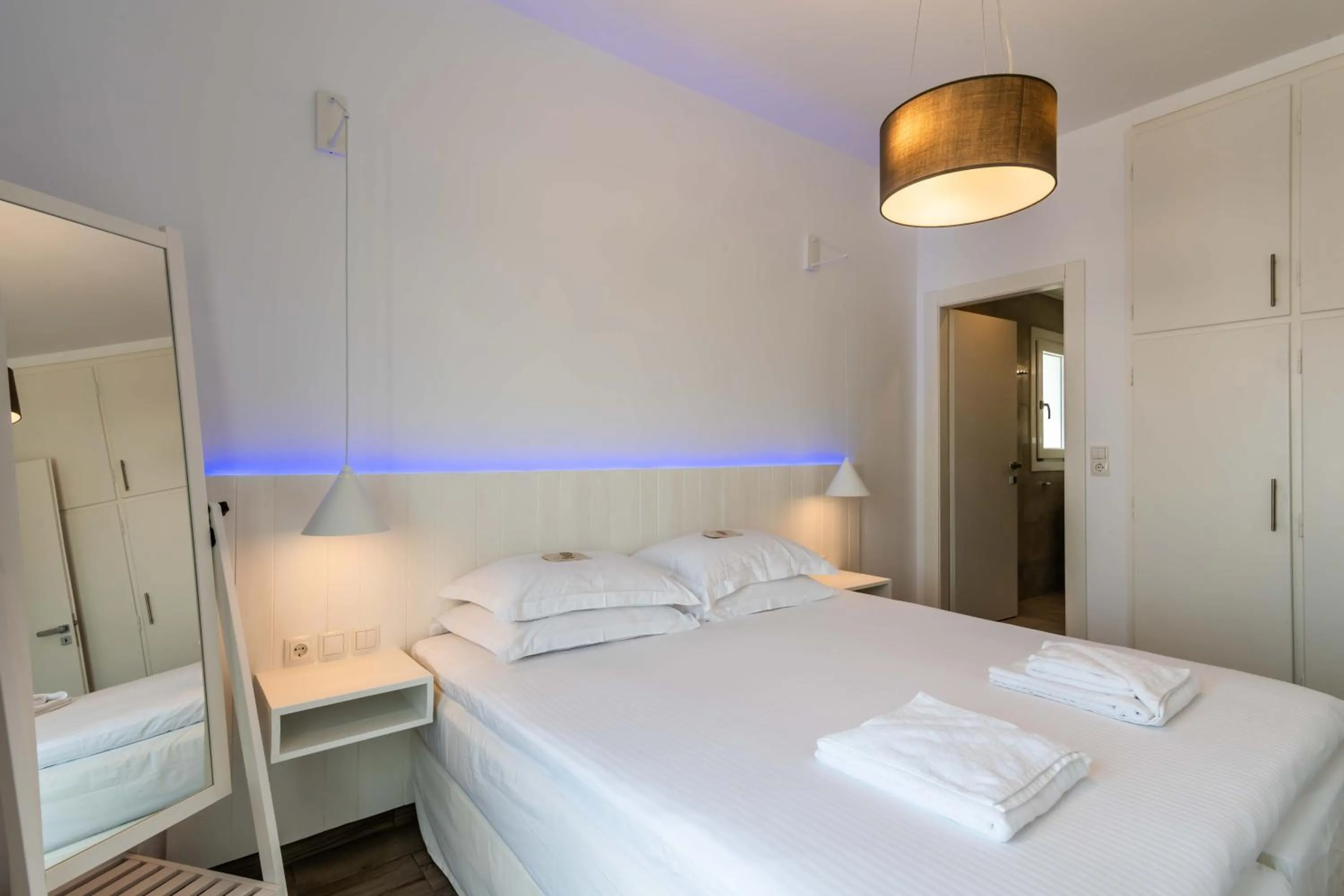 Bed in White Rock Milos Suites