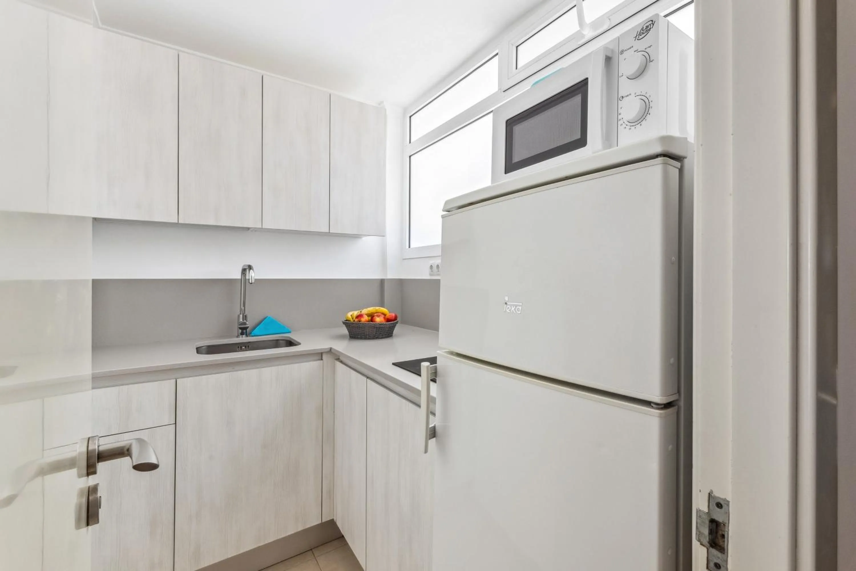 Kitchen or kitchenette in Apartamentos El Capricho