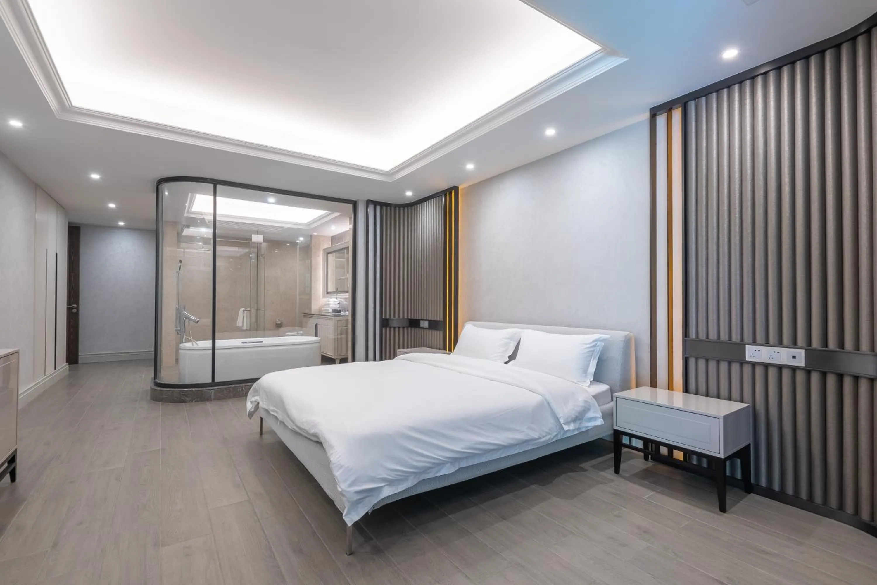 Bed in HaitangBay Loosen Coast Resort Villas