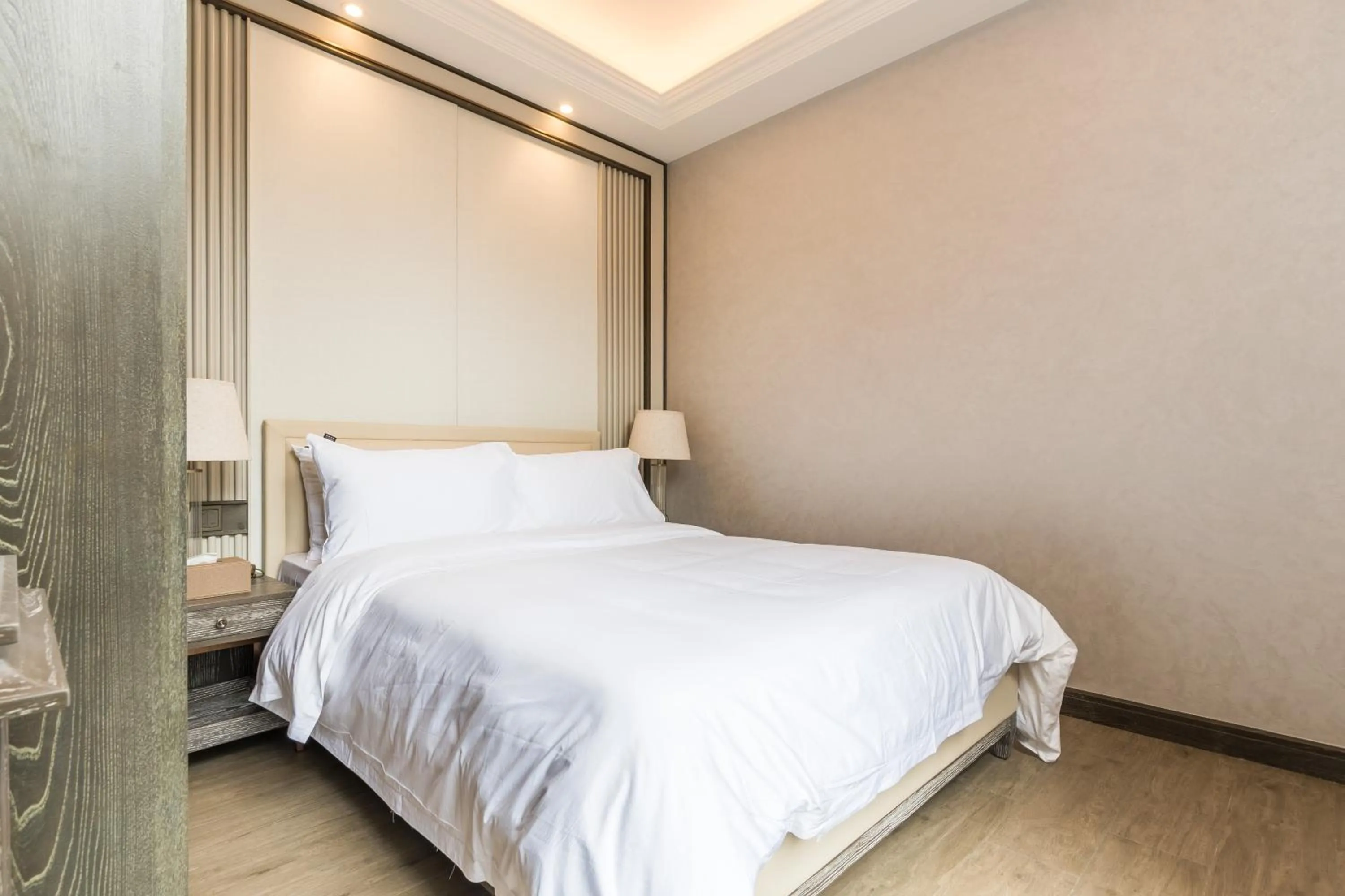 Bed in HaitangBay Loosen Coast Resort Villas