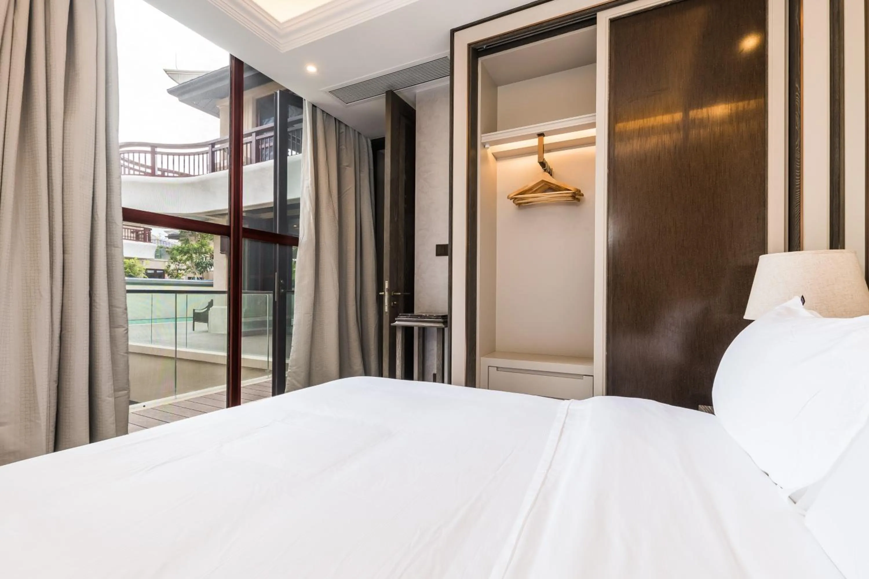 Bed in HaitangBay Loosen Coast Resort Villas