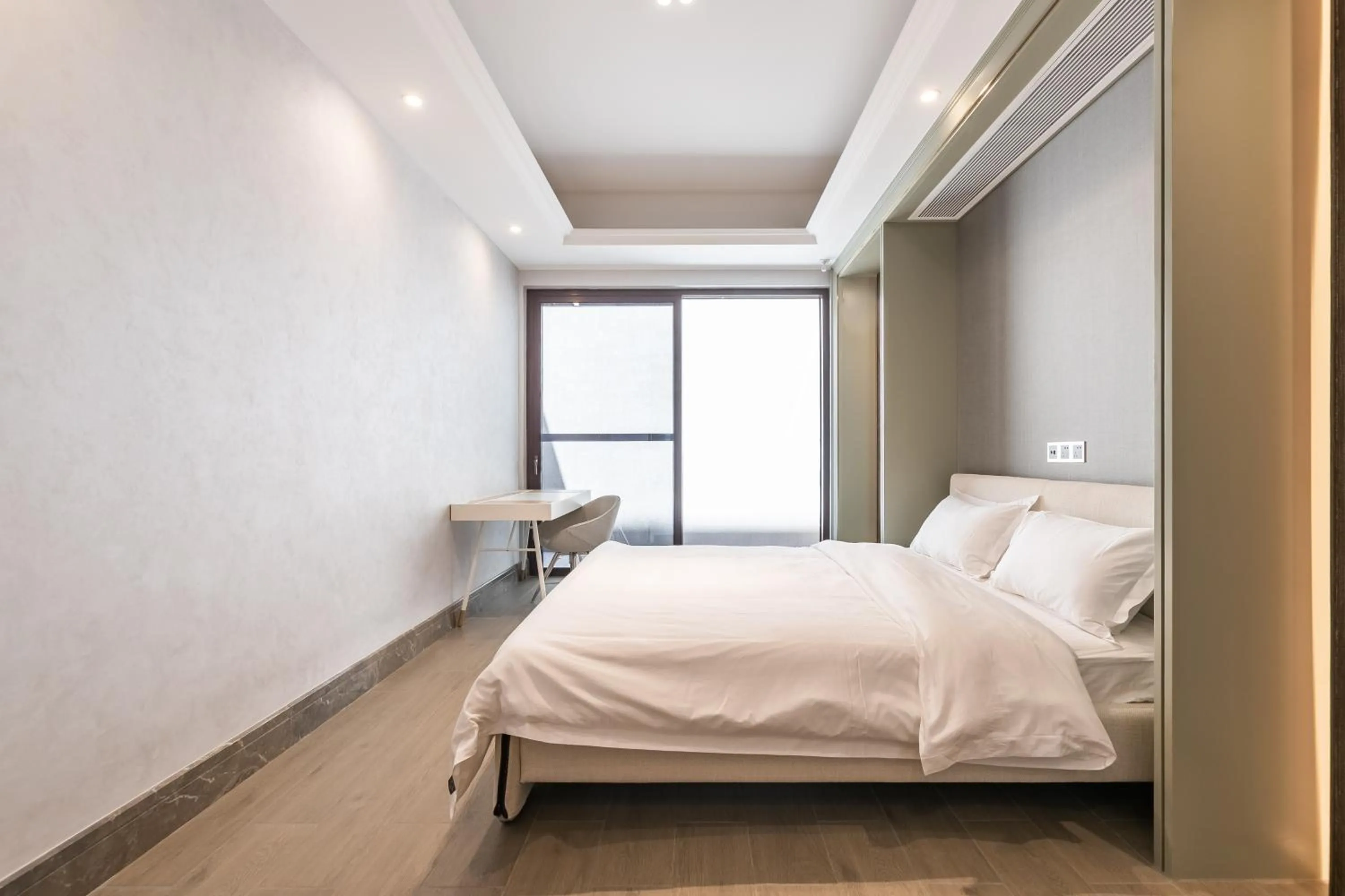 Bed in HaitangBay Loosen Coast Resort Villas