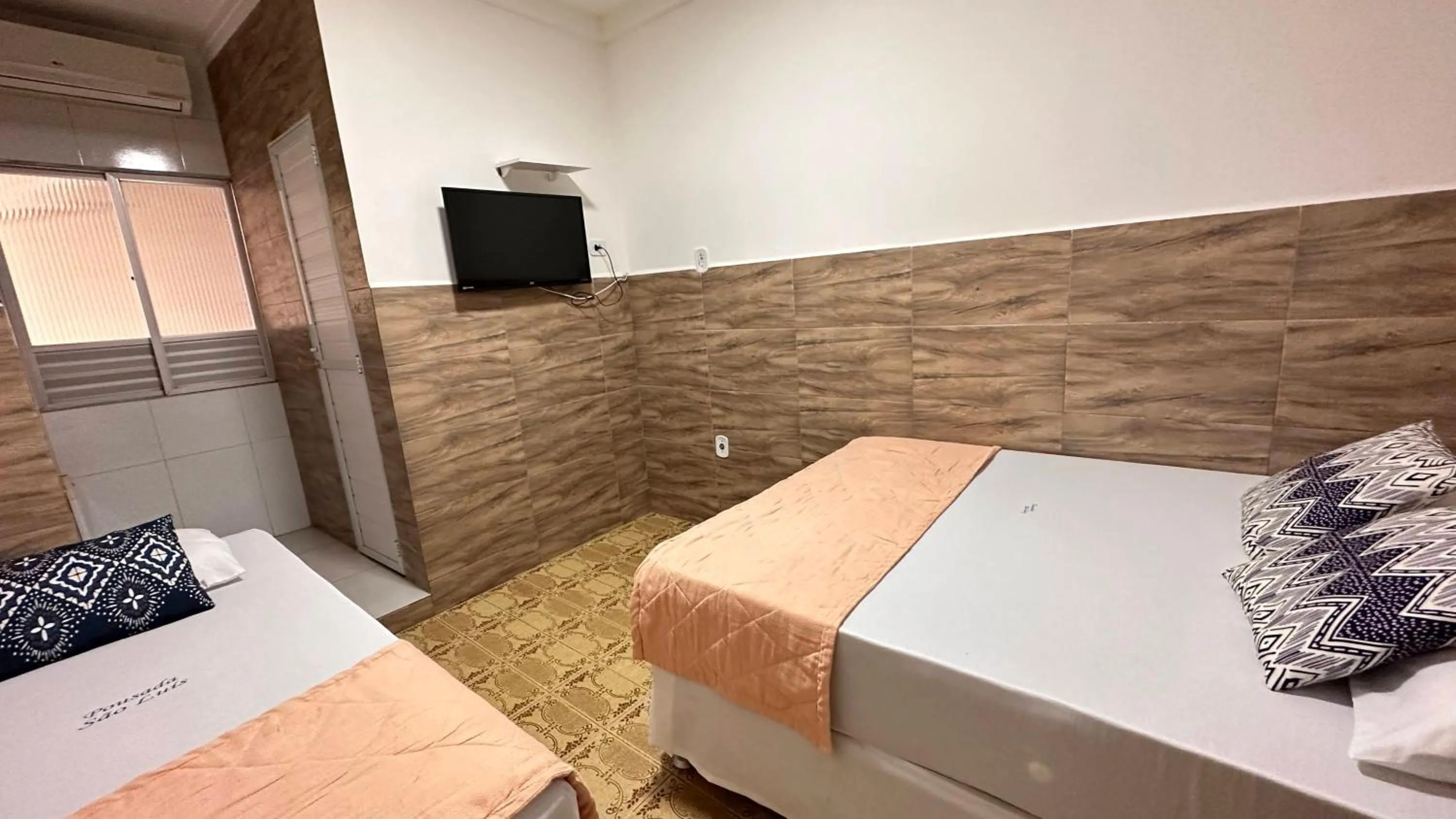 Bed in Pousada São Luiz