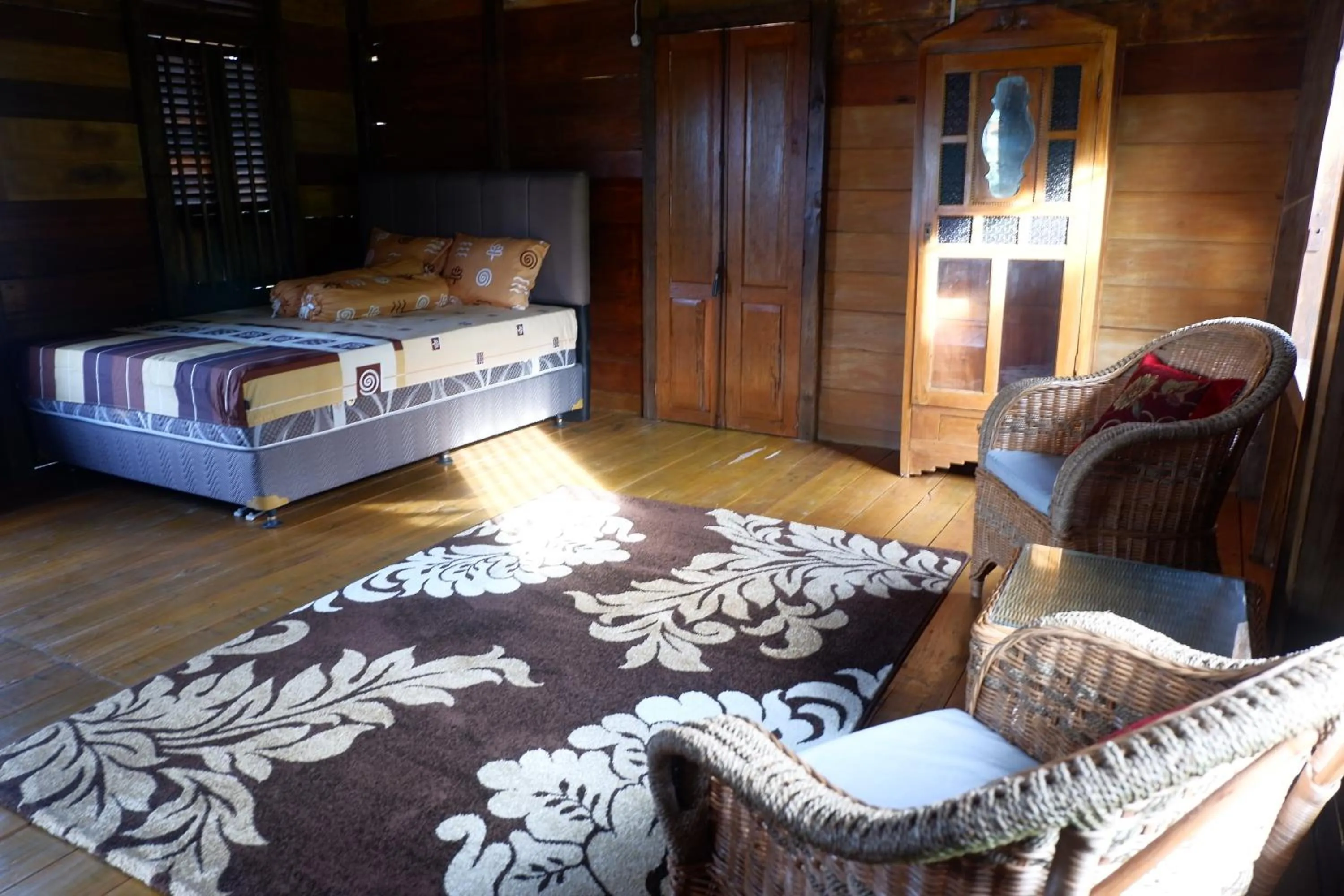 Photo of the whole room, Bed in Rock and Wreck Dive Resort