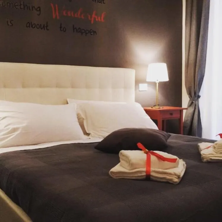 Bed in 109 SUITES ROMA