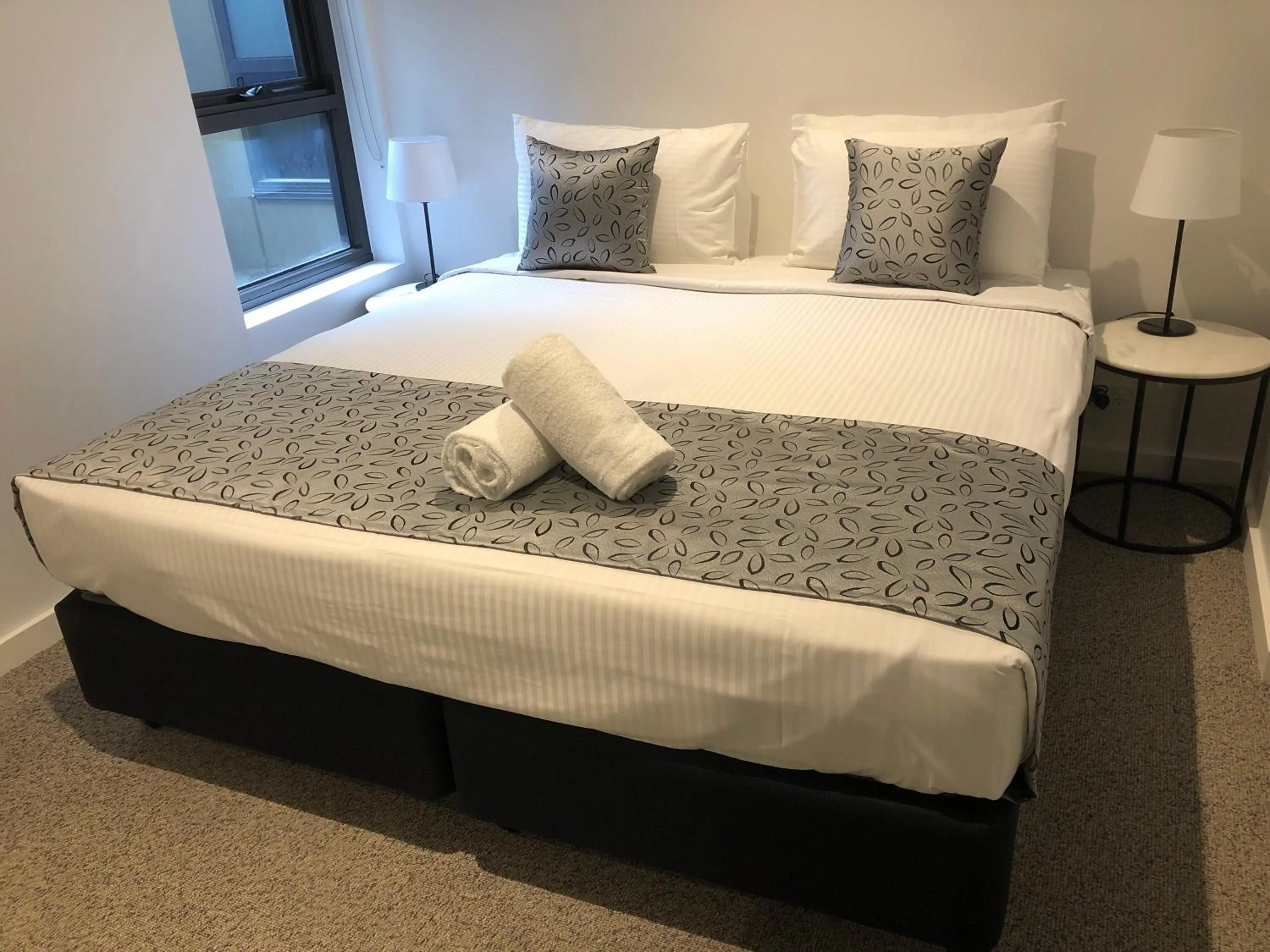 Bed in Q Squared Serviced Apartments