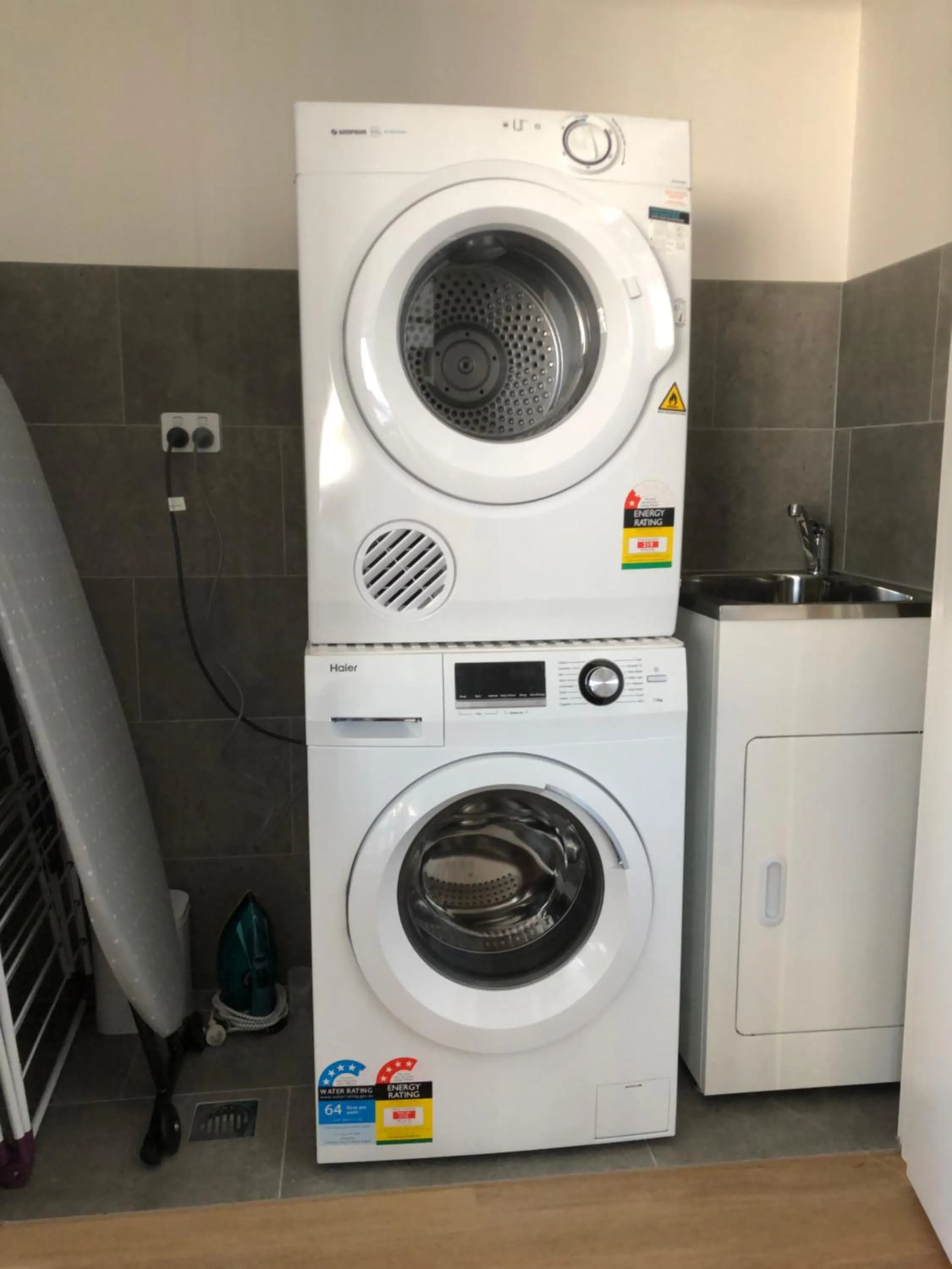 washing machine in Q Squared Serviced Apartments