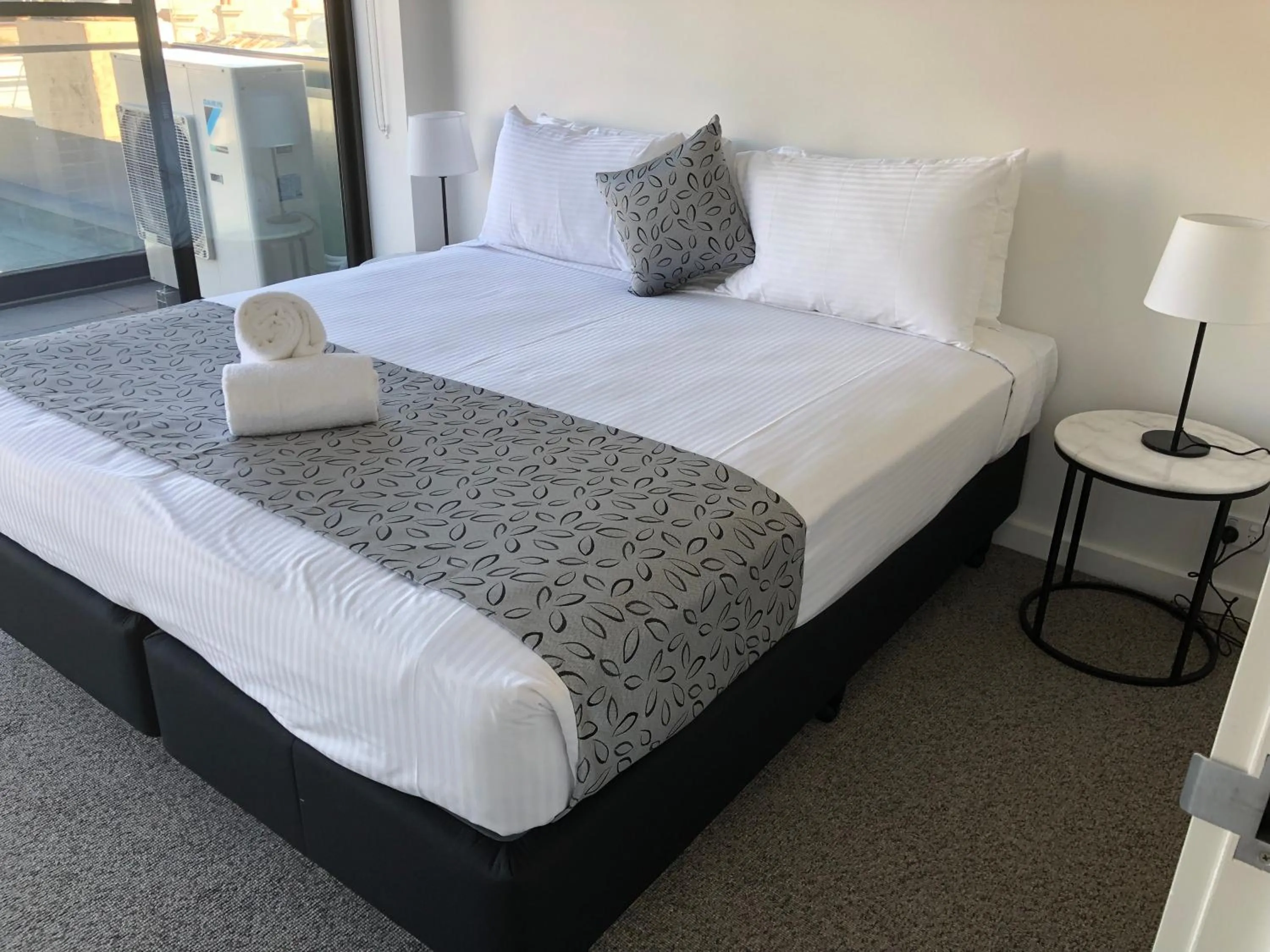 Bedroom, Bed in Q Squared Serviced Apartments