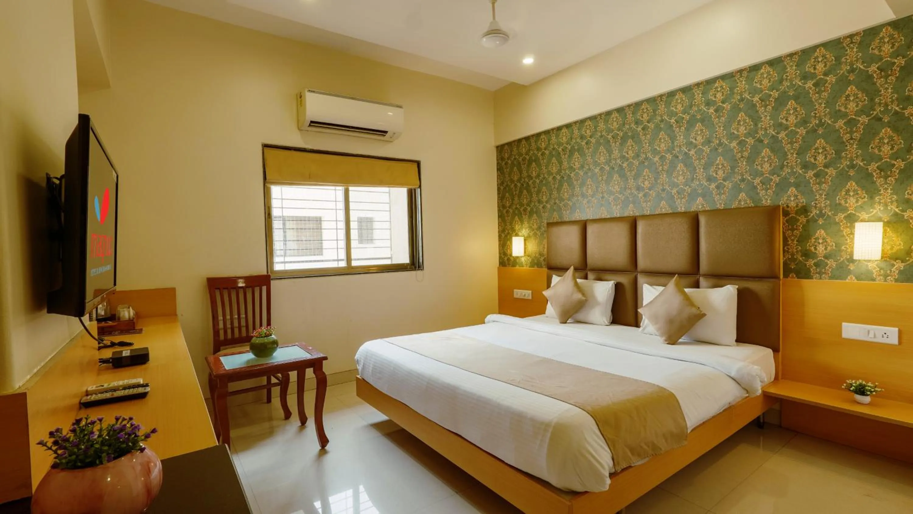 Bed in Magnus Square Business Hotel near Pune Airport
