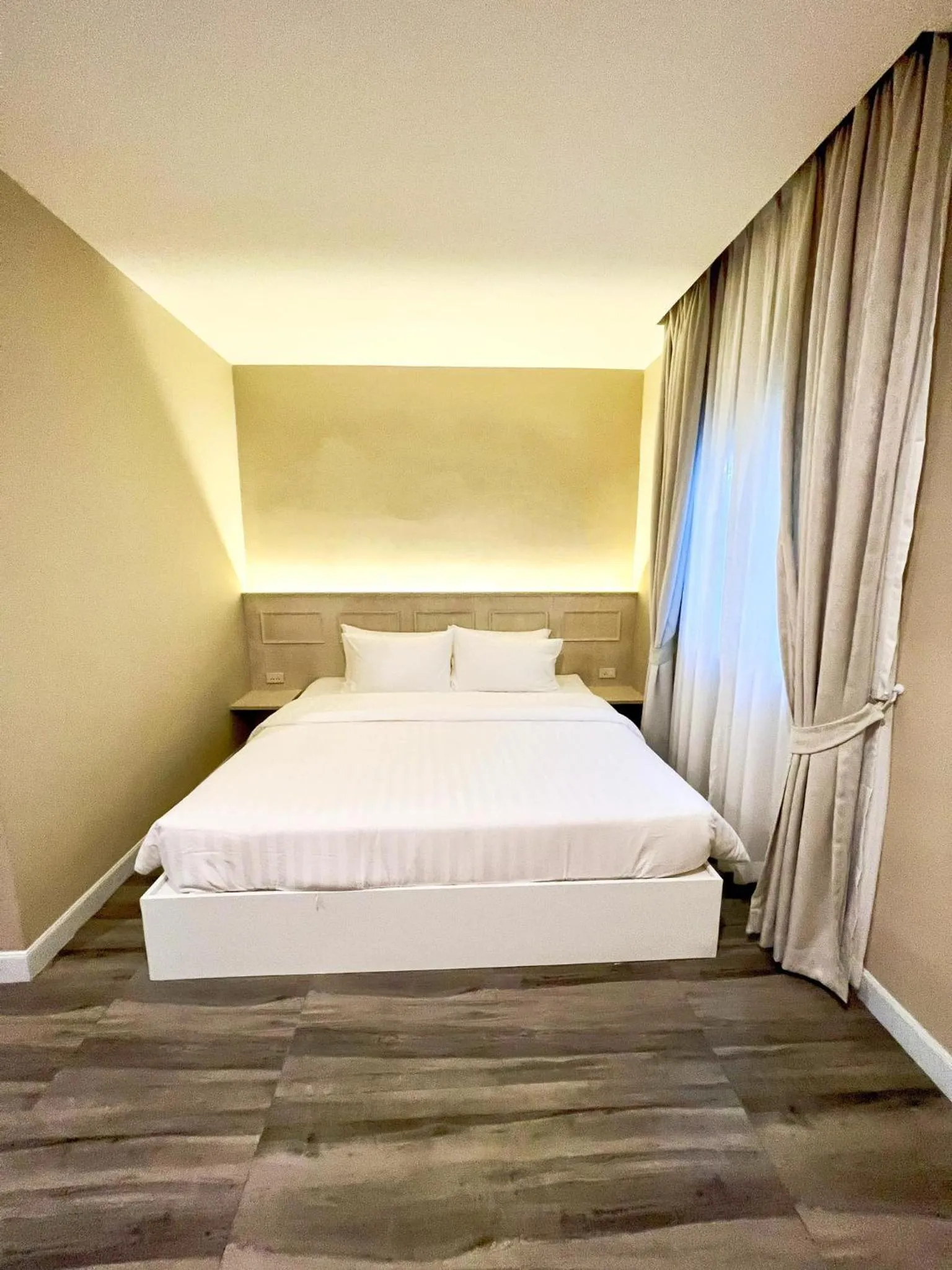 Bed in Srikij GardenHome Resort