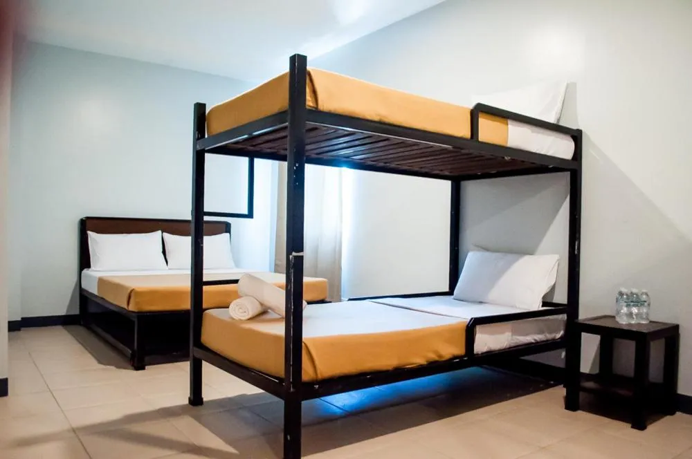 Bed in Seasons Hotel Sablayan