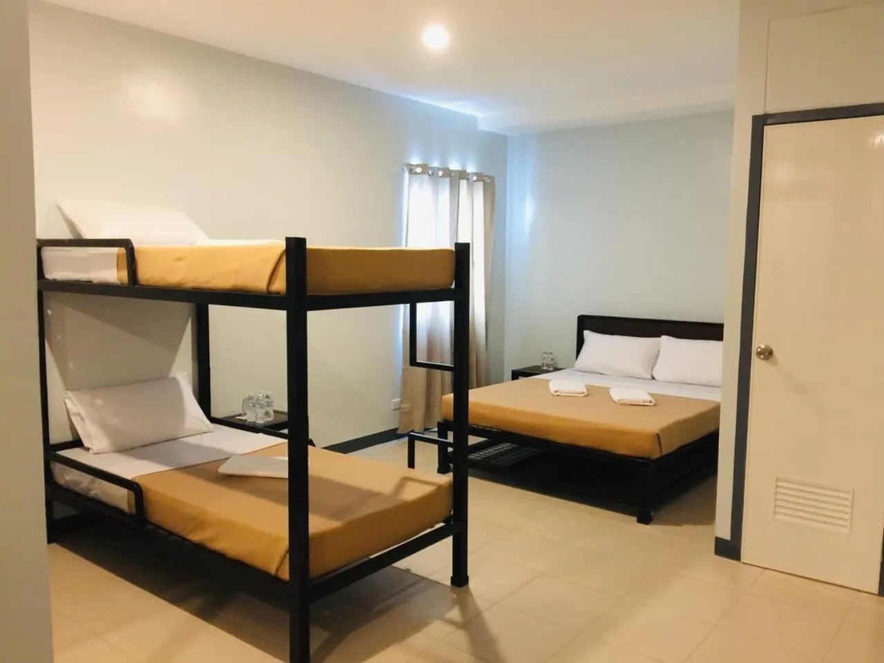 Bed in Seasons Hotel Sablayan