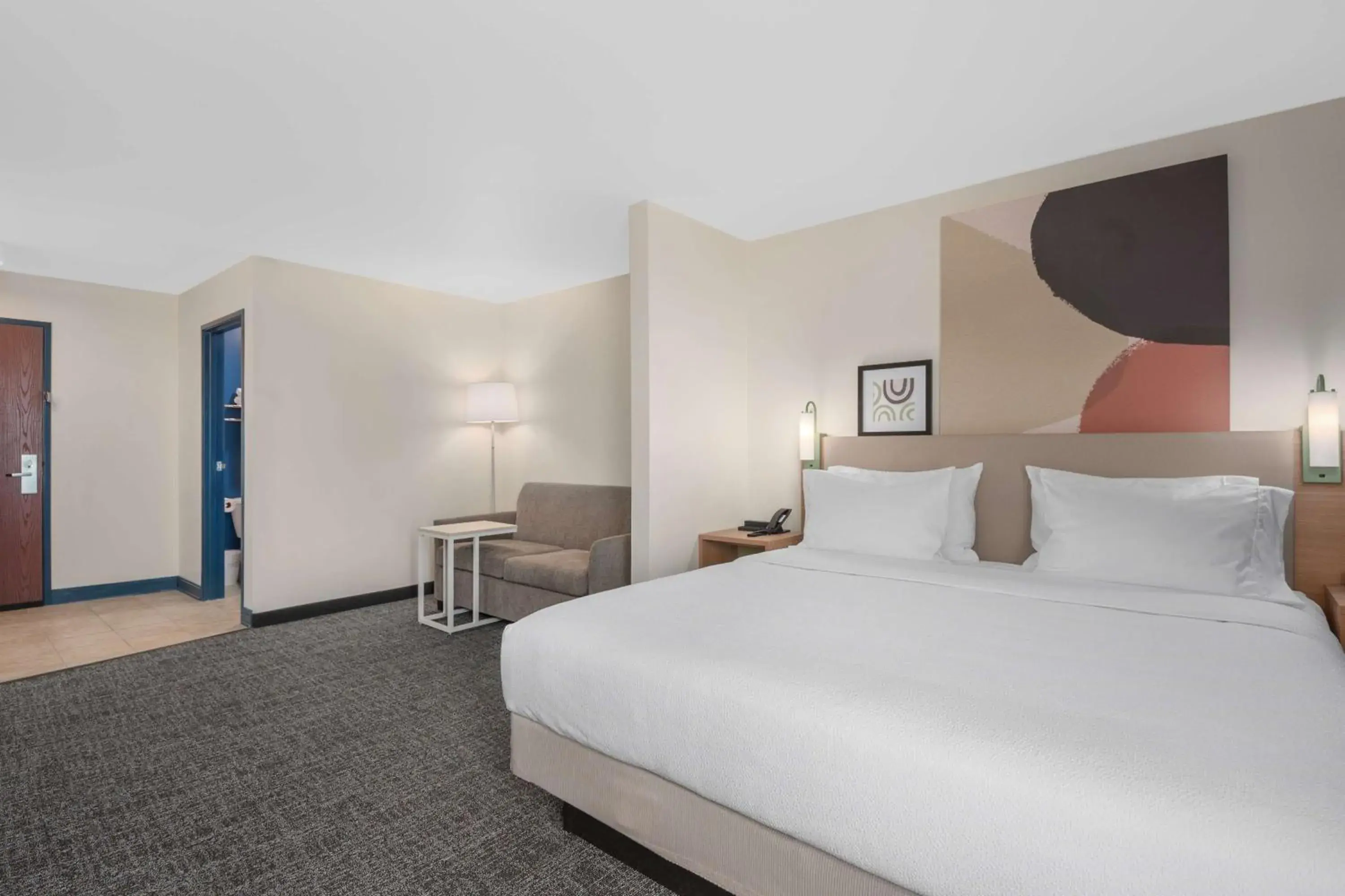 King Room with Sofa in Spark by Hilton Minot King Room with Sofa in Spark by Hilton Minot