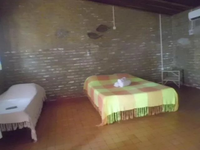 Bed in Chalemar Hotel Pousada